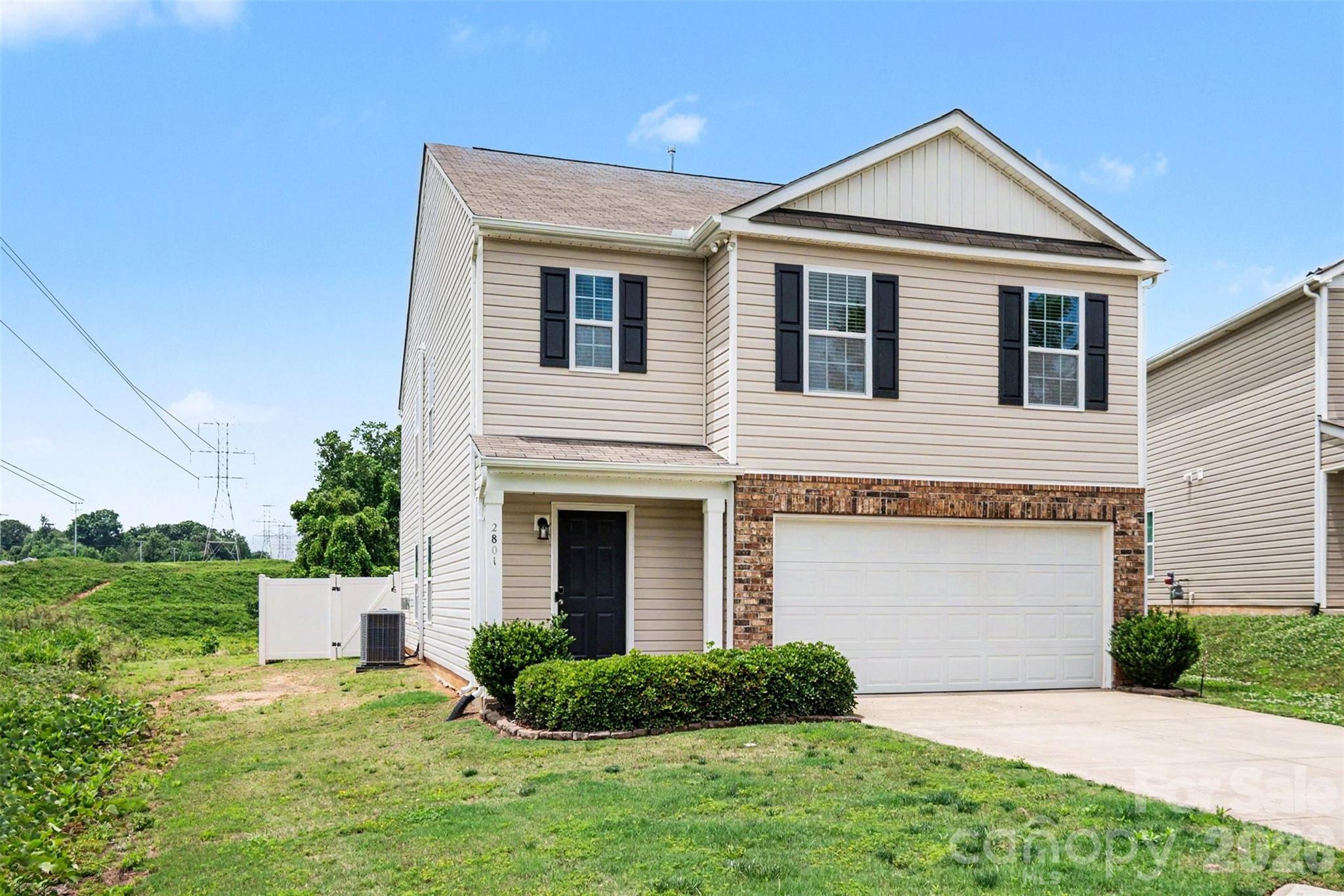 Beautifully maintained 2-story home situated in a cul-de-sac location in Dallas, NC. Built in 2018, this spacious 5-bedroom, 3-bath home offers an open and functional main-level layout perfect for everyday living and entertaining. The living, dining, and kitchen areas feature durable LVP flooring, a center island with additional seating and prep space, and a beautiful fireplace that anchors the main living area. Fresh interior paint throughout and new flooring in the upstairs hallway areas give the home a clean, updated feel. All bedrooms feature carpet for added comfort. Enjoy the convenience of a 2-car garage plus additional driveway parking. Refrigerator, washer, dryer, garage freezer, and all alarm and outdoor camera equipment will convey with the home. HVAC was replaced in 2025 with all new ductwork.