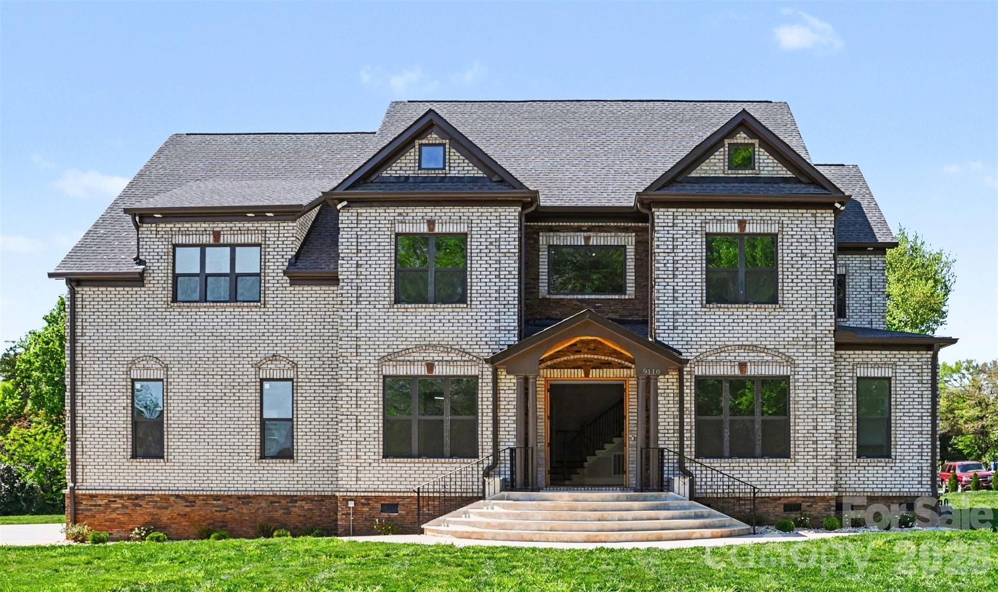 Experience refined living in this stunning, fully custom-built home set on a spacious one-acre homesite. From the moment you arrive, the striking brick exterior, grand entry, and expansive driveway set the tone for the level of craftsmanship and detail found throughout.

Inside, the home opens to bright, thoughtfully designed spaces with glowing hardwoods, elegant trim work, and an effortless flow ideal for both everyday living and entertaining. The main living area is anchored by a fireplace and framed by large windows that bring in natural light and serene views of the surrounding property. A dedicated dining space and additional sitting areas provide flexibility, while the overall layout feels both open and intentionally defined.

The kitchen is a true centerpiece, designed with both style and function in mind. A large island, custom cabinetry, and designer finishes are complemented by a high-end ZLINE appliance package, including a gas range and double wall ovens, creating a space that is as beautiful as it is practical.

Each bedroom offers a private retreat, complete with its own en-suite bathroom and walk-in closet. Custom built-in shelving in every closet adds a level of organization and luxury rarely found, while the primary suite stands out with its spacious layout, including a private sitting room, tray ceiling detail, and a spa-like bath featuring a soaking tub, oversized shower, and dual vanities. The primary en-suite is further enhanced by oversized dual closets with custom built-ins.

Upstairs and throughout the home, every detail has been carefully selected, including premium, double-padded carpeting that adds comfort and durability. As a newly completed home that has never been lived in, everything feels fresh, pristine, and ready for its first owner.

The outdoor living spaces continue the home’s appeal, with double screened-in porches providing exceptional entertaining space while overlooking the expansive backyard. Set on a level, open acre, the property offers endless possibilities for relaxation or future customization. The seller had a 6 foot vinyl fence installed June 4 for added privacy.

Located within an exclusive gated enclave of just four homes and with no HOA, this property offers a rare blend of privacy, freedom, and convenience in a highly desirable setting. Fence being installed on 6/4, NO CITY TAXES!