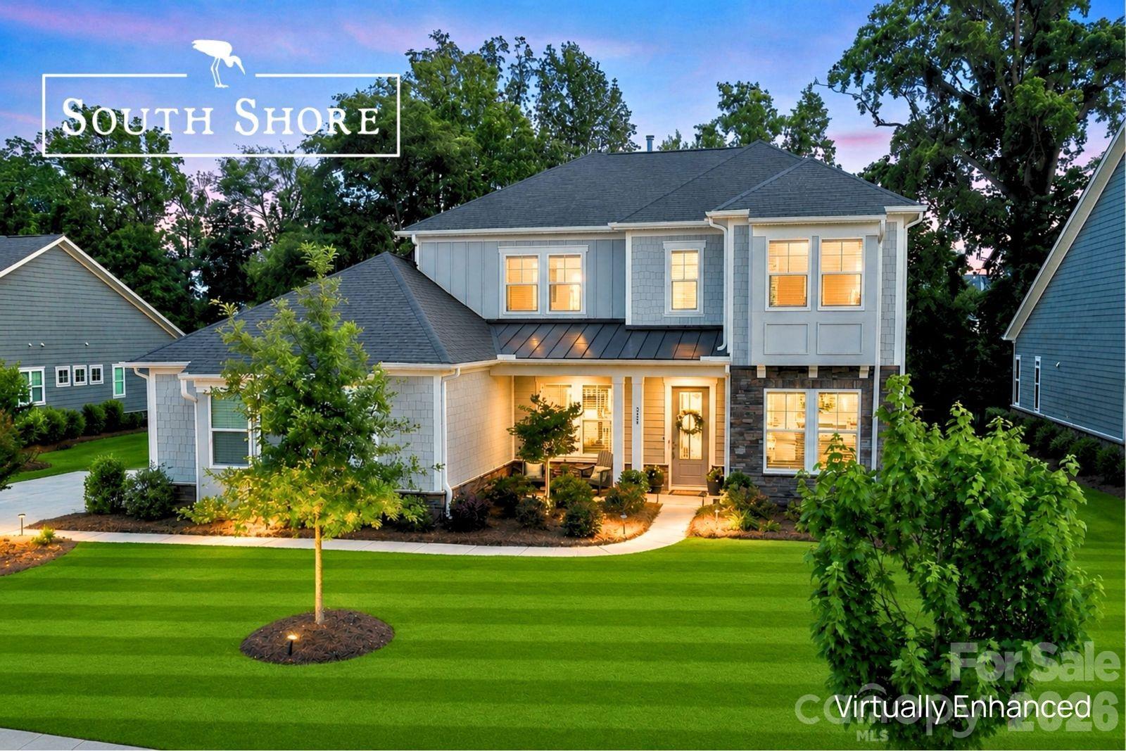 Stylish South Shore Sanctuary with Spectacular Outdoor Living

Lake living, luxury, and exceptional entertaining converge at 223 Lanyard Lane in Belmont’s highly sought-after waterfront community of McLean – South Shore.

Beautifully upgraded and thoughtfully designed, this stunning home offers the perfect blend of elegance, comfort, and resort-style living just moments from Lake Wylie. Filled with natural light and upscale finishes throughout, the open-concept layout creates inviting spaces for both everyday living and unforgettable gatherings.

At the heart of the home, the gourmet kitchen features quartz countertops, a direct-vent chimney-style hood, quality finishes, and seamless flow into the spacious living and dining areas. Just off the dining space, a built-in home office creates a convenient secondary workspace or homework station — ideal for today’s flexible lifestyle alongside the home’s primary office space.

The luxurious owner’s suite feels like a private retreat, highlighted by a dramatic 42” linear fireplace and a spa-inspired bath featuring a soaking tub, oversized walk-in shower with dual-side access, and elegant finishes throughout. The suite also offers direct access to the laundry room — a thoughtful design feature that blends luxury with everyday convenience.

Additional interior upgrades include oak box stairs with stylish metal balusters, ceiling fans throughout, a Rinnai tankless water heater, rain shower upgrade, frameless glass shower enclosure, and beautifully appointed living spaces designed for both comfort and sophistication.

The outdoor living experience is equally impressive and was clearly designed as a true extension of the home itself. Backing to a peaceful wooded setting, the fully fenced backyard offers both privacy and beauty, enhanced by expansive pavered entertaining spaces, low-voltage landscape lighting, and a custom stone-step stairwell leading to the rear of the property.

The screened porch and patio area create an incredible year-round retreat featuring a cozy outdoor fireplace with TV wiring above the mantel, natural gas supply, ceiling fan, and elegant paver flooring — perfect for football Saturdays, quiet evenings, or entertaining guests. The fully equipped summer kitchen elevates the experience even further with a premium Napoleon grill, separate sear burner, stainless cabinetry, beverage refrigerator, sink with hot and cold water, and both natural gas and electrical connections already installed.

Car enthusiasts and storage lovers alike will appreciate the impressive 3-car garage configuration, featuring a side-load 2-car bay plus an additional front-load single bay, all enhanced by premium epoxy-coated flooring for a clean, polished finish.

Beyond the home itself, McLean – South Shore offers one of the most desirable lifestyle experiences in the region, featuring a stunning clubhouse, resort-style pool, playground, scenic walking trails, and easy access to the Carolina Thread Trail system and nearby Daniel Stowe Botanical Garden. Residents enjoy the perfect blend of nature, recreation, relaxation, and convenience — all just minutes from charming downtown Belmont, waterfront dining, shopping, and an easy commute to Charlotte.

Whether it’s lake days, evenings around the fire, morning walks beneath the trees, or gathering with neighbors by the pool, life at South Shore feels like a permanent retreat.

“Home should feel like your favorite getaway.”