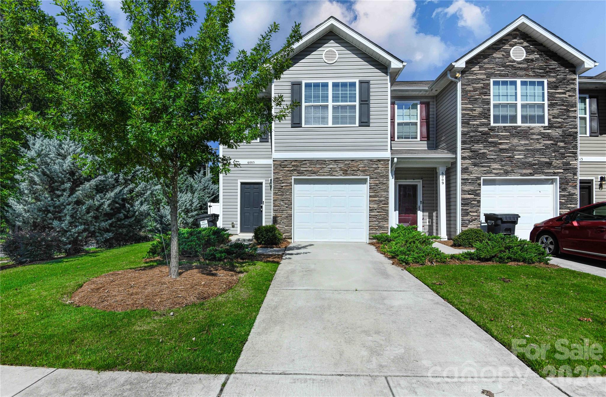 Welcome home to this beautifully maintained corner unit townhome offering the perfect combination of comfort, convenience, and low maintenance living. Step inside to an inviting open floor plan designed for everyday living and entertaining. The kitchen features stainless steel appliances and flows seamlessly into the dining and living areas, creating a bright and welcoming atmosphere. Enjoy the added privacy of a corner unit along with a fenced outdoor space and extended patio, perfect for relaxing, grilling, entertaining, or enjoying your morning coffee. An attached garage provides convenient parking and additional storage. Ideally located near shopping, dining, entertainment, and everyday conveniences with easy access to major roadways. Fresh, inviting, and ready for its next owner, this home offers the space, location, and features buyers are looking for. Schedule your showing today and make this one yours!