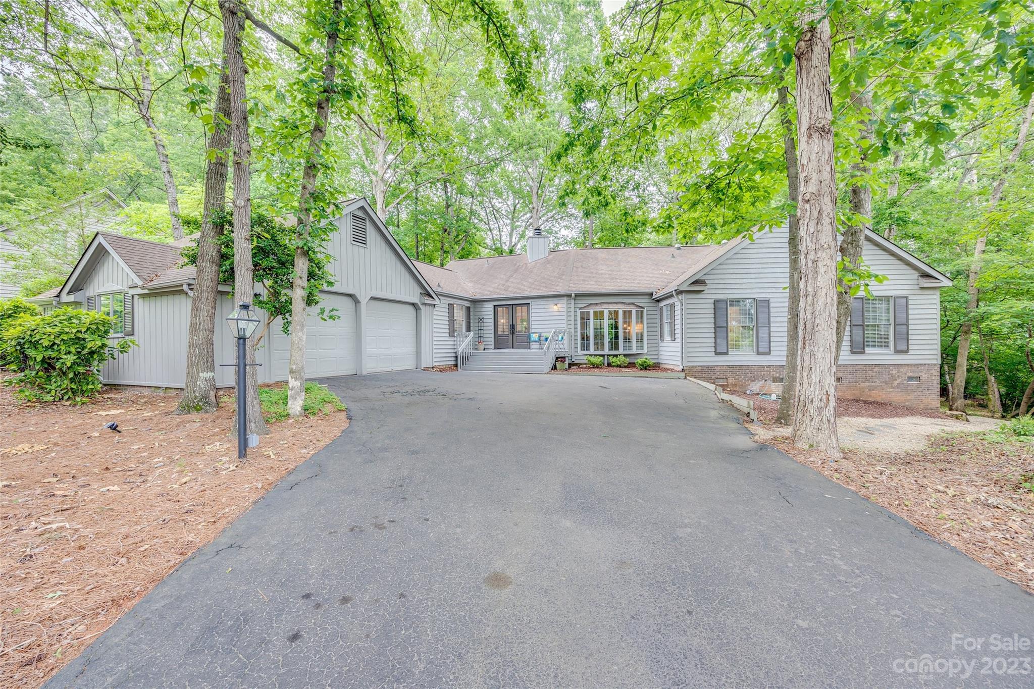 Amazing, updated RANCH home in the gated community of River Hills. This home was renovated even further by this seller and has year-round water views from the front and back of the house. Updates include: new kitchen cabinets, countertops, backsplash, light fixtures throughout, new water heater, new primary bathroom which includes tile, vanity, shower, mirrors, fixtures, and additional closet space. Newly enlarged closet in the primary bedroom and new ceiling fans. New LVP floors throughout, all new interior paint, new crown molding and baseboards, new gas firebox with remote, and new fireplace hearth and surrounding tile. New front door with new wood siding and new French doors leading you to a totally renovated TREX back deck. Fenced in back yard, exterior of the house has been painted and all rotten siding has been replaced. Tree work, landscaping, the list goes on! You do not want to miss this GEM, and award-winning Clover Schools!