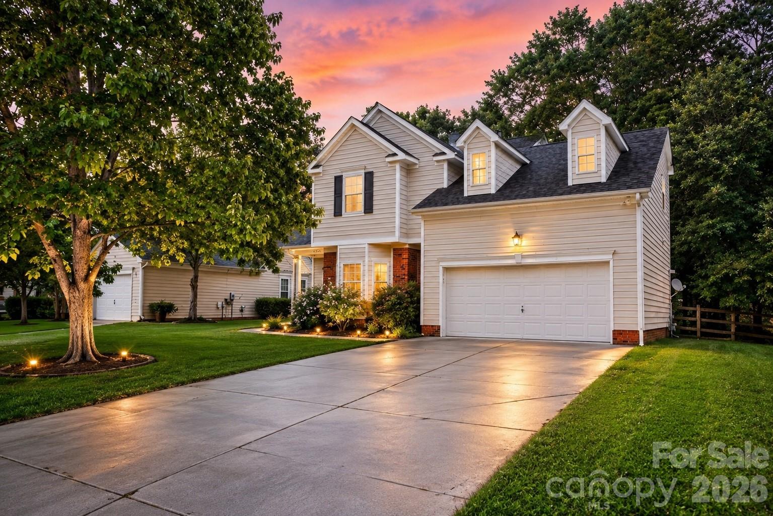 ONE OF THE MOST PRIVATE LOTS IN THE CROSSINGS
Welcome to The Crossings, one of Southwest Charlotte's most desirable communities, offering a neighborhood pool, playground, walking trails, and convenient access to Rivergate, Lake Wylie, the U.S. National Whitewater Center, Charlotte Premium Outlets, and I-485. This beautifully maintained 4-bedroom, 2.5-bath home combines thoughtful updates, functional living space, and one of the most private backyards in the neighborhood.

Step inside to an open and inviting floor plan featuring updated flooring, abundant natural light, spacious living and dining areas, and a cozy family room with a wood-burning fireplace. The bright eat-in kitchen offers ample cabinet space and a bay window overlooking the backyard, creating the perfect setting for everyday living and entertaining.

Upstairs, the spacious primary suite features a vaulted ceiling, walk-in closet, dual vanities, a soaking tub, and separate shower. Three additional bedrooms provide flexibility for guests, a home office, playroom, or workout space.

The true highlight of this home is the fully fenced backyard backing to mature trees and a peaceful natural area, creating a private retreat rarely found at this price point. Whether you're enjoying your morning coffee, hosting friends, or simply unwinding after a long day, you'll appreciate the privacy and tranquility this outdoor space provides.

Additional features include a main-level laundry room, attached two-car garage, and access to outstanding community amenities. Conveniently located near shopping, dining, recreation, top employers, and major commuter routes, this move-in ready home offers the perfect combination of comfort, privacy, and location.

Schedule your private showing today and discover why homes with this level of privacy and convenience are so hard to find.