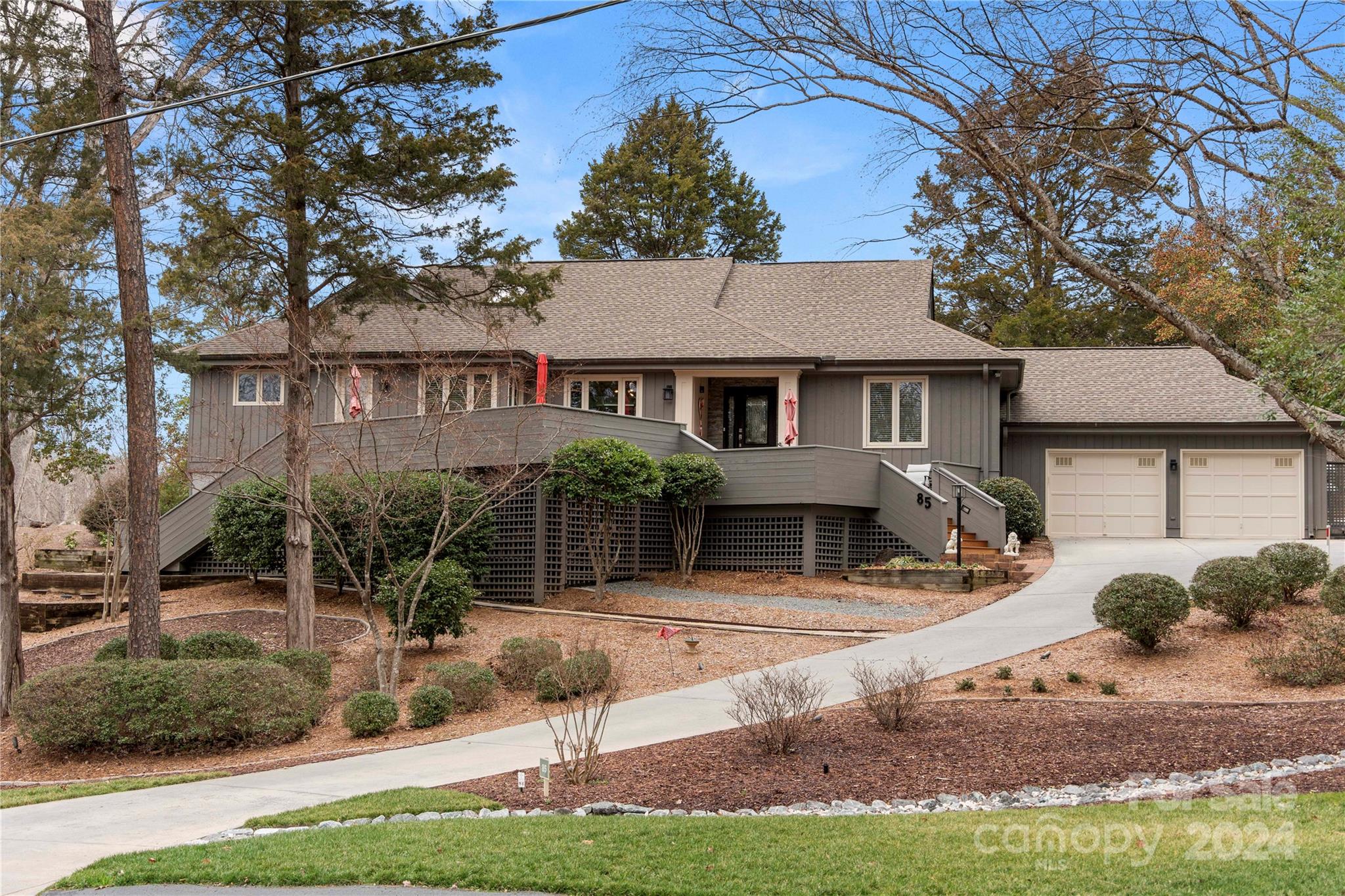 This meticulously renovated golf course ranch is what you've been looking for! You'll notice the carefully landscaped, low maintenance front yard as you drive up to the 2 car garage & spacious front porch. Maple hardwood flooring welcomes you into the home where you can't miss the inviting finished sun-room ahead which overlooks the 10th fairway of the golf course. Entertain in the beautiful kitchen w/ island & a natural flow into the dining area & wet bar. Primary suite offers sliding doors to your back deck & a beautiful primary en-suite bathroom w/ under vanity & in cabinet  lighting & walk-in closet. Need an office or 4th bedroom? No problem! The 14' x 20' guest room can easily be converted into 2 separate bedrooms, or a bedroom & an office! With its own exterior entrance there is a heated & cooled finished room  being used as a workshop (not counted in listed square footage). Bonus points for golf cart drivers, park your cart right under your front deck! Showings start 9/23