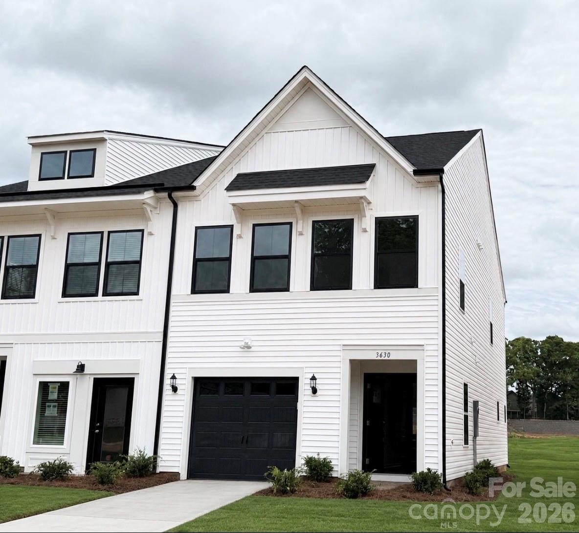 This Duet style two-story townhome includes three bedrooms and two-and-one-half bathrooms. Immediately inside the entrance, a hallway leads past the staircase and half bathroom and into the open concept great room with a fireplace, eat-in, kitchen, and patio. Upstairs, the primary suite features a walk-in closet, a tray ceiling, and dual vanities. A laundry closet is located just outside of the primary suite for ultimate convenience. Two secondary bedrooms and one full bathroom are also located upstairs. A one-car garage along with a bench and cubbies complete this floor plan. Additional windows on both levels ensure abundant natural light in the home.