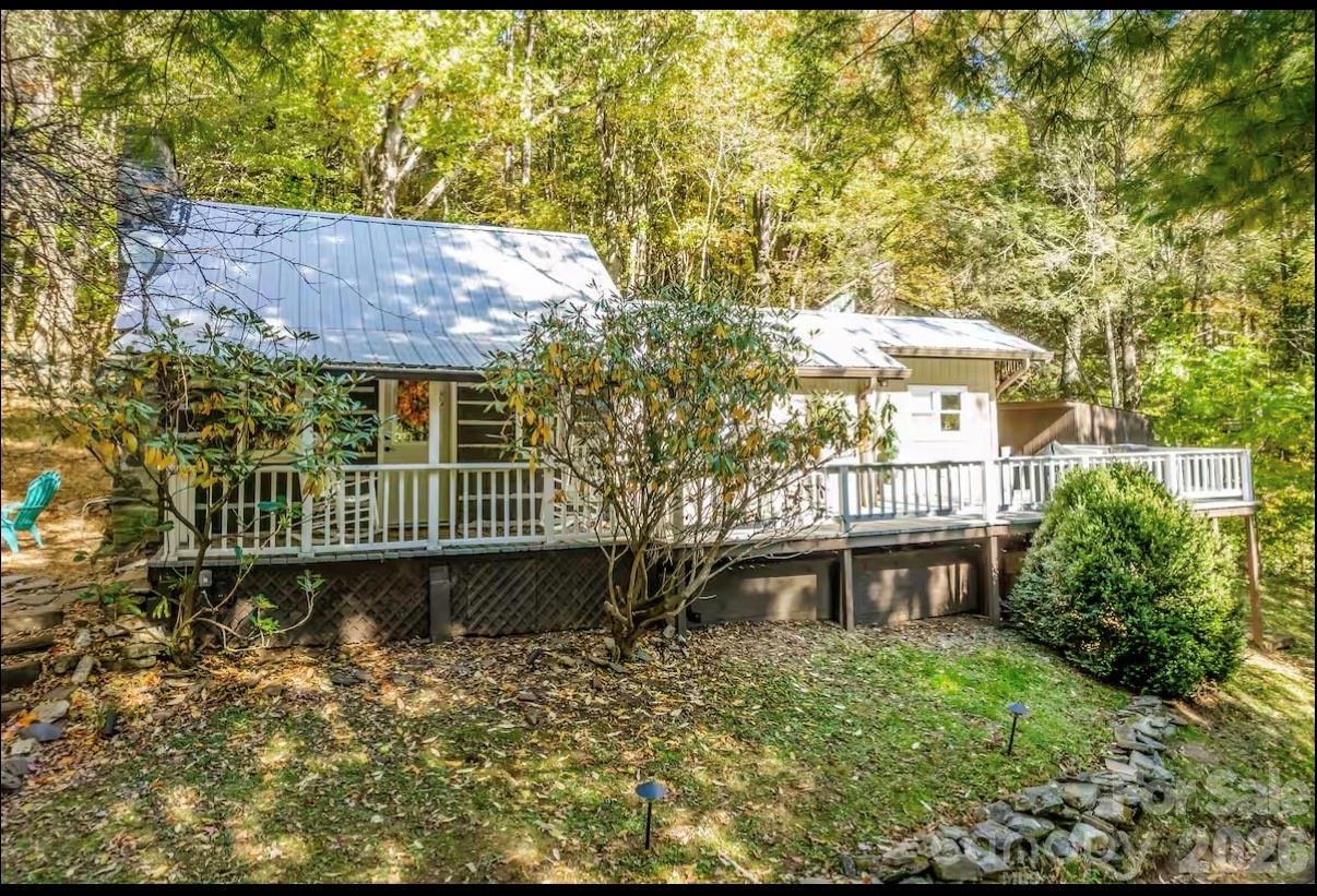 Welcome to 284 Grady Winkler Road — a turnkey mountain retreat and proven income-producing property in the heart of the North Carolina High Country! INCOME EARNED ON AIRBNB ALONE 2023 $36,000, 2024 $44,000, 2025 $32,000, YTD $20,000.  Nestled in a private, peaceful mountain setting, this beautiful cabin offers the perfect blend of modern comfort, rustic charm, and investment potential. Currently operating as a successful short-term and long-term rental, this property comes fully furnished and ready for immediate enjoyment or continued rental income. NO HOA.

Inside, you’ll find tasteful recent updates designed for modern appeal while maintaining a warm mountain atmosphere. Step outside onto the expansive wooden deck stretching across the entire front of the home — the perfect place to relax, entertain, or enjoy the serene wooded surroundings. The hot tub, all linens, and additional supplies are included, making this a truly effortless turnkey opportunity for investors or second-home buyers alike.

Conveniently located near some of the High Country’s most popular destinations and attractions:
• Appalachian State University – approx. 6 miles
• Downtown Boone – approx. 6 miles
• Appalachian Ski Mountain – approx. 11 miles
• Blowing Rock – approx. 13 miles
• Grandfather Winery & Vineyard – approx. 15 miles