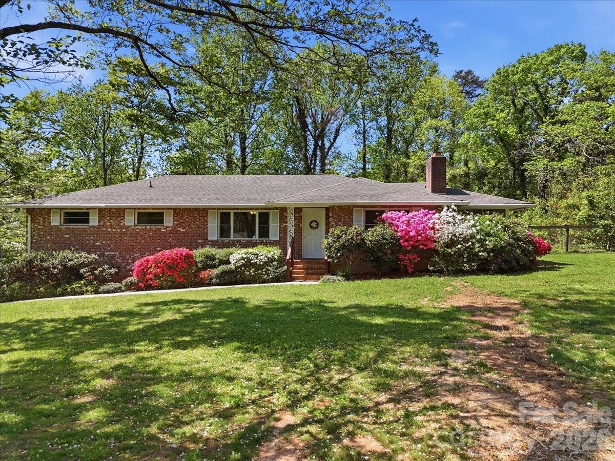 Charming 1970s brick ranch located within the city limits of Columbus, NC! Situated on a quiet street, this home offers the perfect blend of peaceful living while still being just minutes from town, shopping, dining, and highly regarded schools.

This well-maintained home features solid construction and great bones, ready for your personal updates and vision. Inside, you’ll find a functional layout along with an unfinished basement offering excellent potential for additional living space, storage, or a workshop.

Enjoy outdoor living with a spacious deck and relaxing sun porch overlooking the generous 0.61-acre lot. The property also includes an outbuilding for added storage or hobby use. Conveniently located near I-26 for easy commuting.