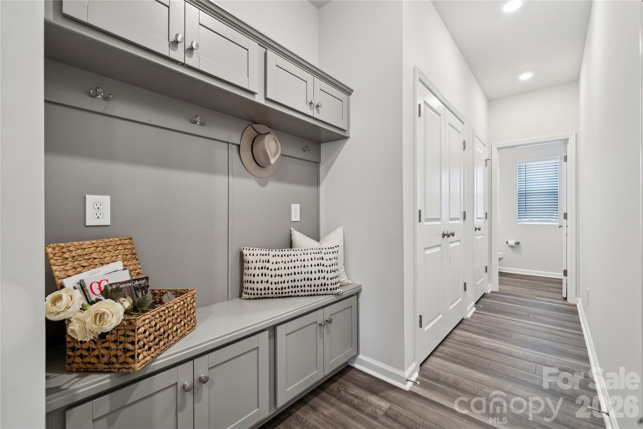Welcome to this thoughtfully designed two-story townhome offering three bedrooms and two-and-a-half baths. Just inside the front entry, you’re greeted by a spacious open-concept family room that flows seamlessly into the kitchen and inviting eat-in dining area—perfect for both everyday living and entertaining.

Upstairs, the primary suite provides a comfortable retreat, complete with a boxed ceiling, a generous walk-in closet, and an en-suite bath featuring dual vanities. Two additional bedrooms and a full bathroom offer flexibility for guests, family, or a home office. A conveniently located laundry closet just outside the secondary bedrooms adds ease to daily routines.

Additional highlights include a one-car garage with direct entry, where you’ll find a powder room and a practical drop zone with built-in bench seating and cubbies—ideal for keeping everything organized and within reach.