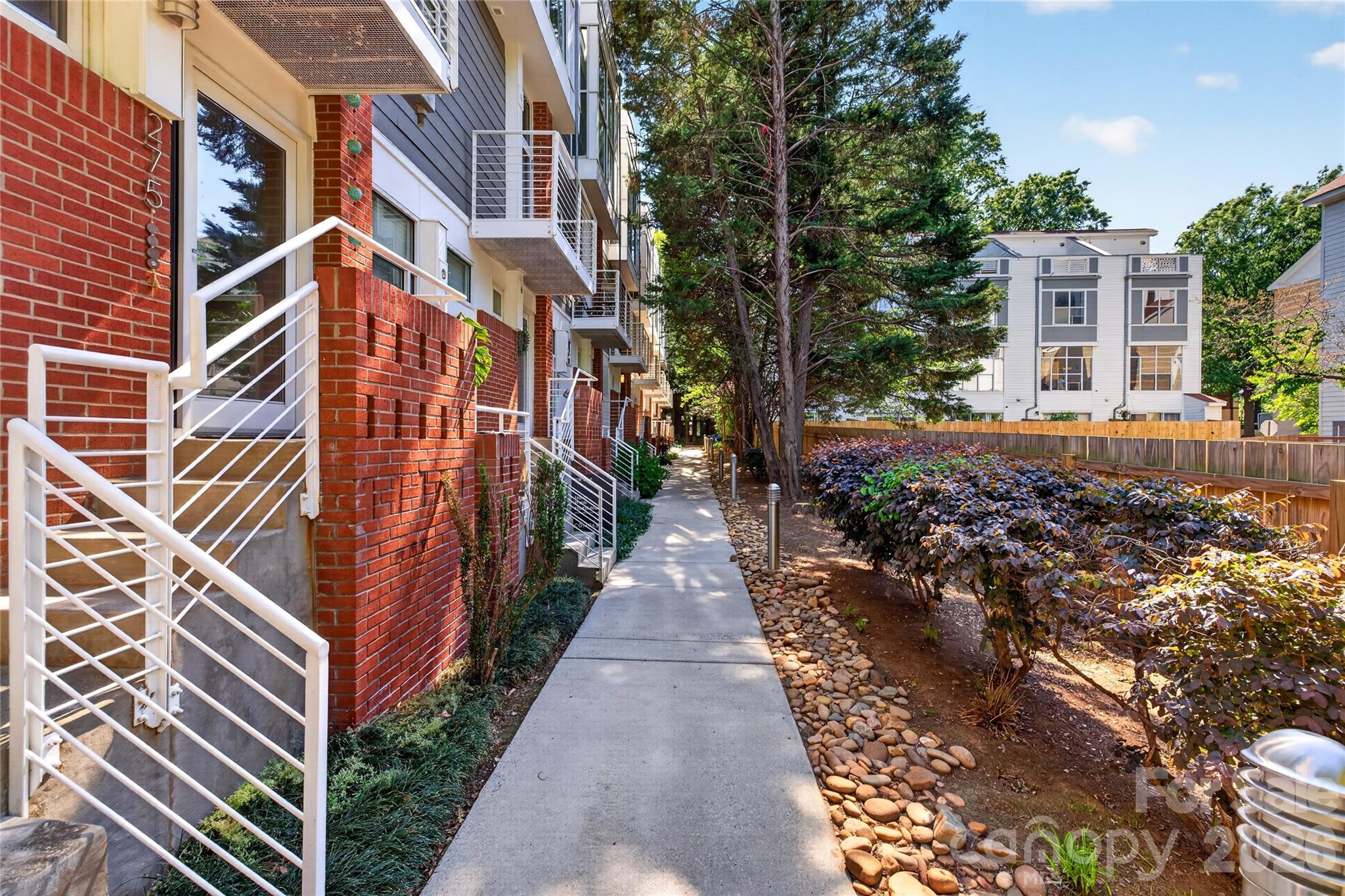 Welcome home to this well-maintained condo, just steps away from Atherton Mill and the heart of South End. Enjoy the calm of Dilworth and bustle of SouthEnd in your own city retreat. This is a true gem with thoughtfully designed spaces for comfort and functionality. This inviting condo provides easy direct exterior access, and offers thoughtfully designed living space with two spacious bedrooms and two well-appointed baths.

Step into a light-filled living room with soaring floor-to-ceiling windows that let the sunshine pour in, perfectly complemented by sleek bamboo floors flowing throughout the home. Open kitchen concept features an island with a breakfast bar, granite countertops, and stainless steel appliances that make cooking and entertaining a breeze.

Retreat to the primary bedroom, complete with two generous closets and the convenience of a stackable washer/dryer tucked away in the en-suite bathroom.

Hard to beat this location for the price point! You’re just a stone's throw away from vibrant shopping, trendy restaurants, cozy pubs, and the light rail. And the condo features two covered off-street parking spots.

Schedule your showing today and make this Dilworth beauty your new home!