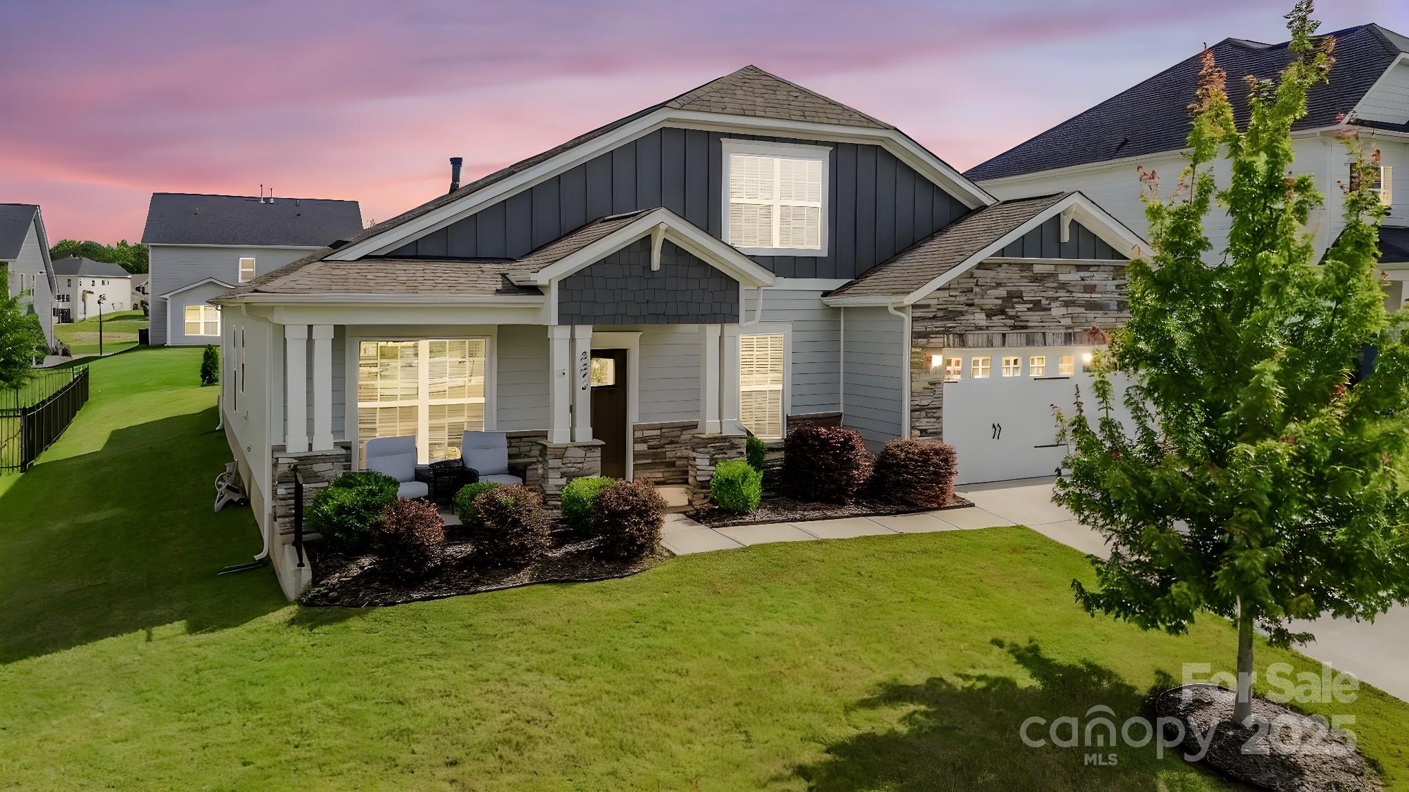 Enjoy South Carolina living, right around the corner from Ballantyne with 3 bedrooms on the main level! Great curb appeal in this like-new home with fiber cement siding, stone accents and covered front porch. Inside, an entry hall leads to formal dining, and a home office/study with french doors. The kitchen has white soft-close cabinetry, quartz countertops, a five burner gas cooktop and wall oven/microwave. It connects to the breakfast area, and living room with gas log fireplace. Three of the four bedrooms are on the first floor, including the primary suite with tray ceiling, bath with dual vanity, shower and soaking tub and walk-in closet. Main level laundry, plus another full bath and 2 beds. Upstairs offers a loft/bonus room, plus another bathroom and bedroom. Relax on the extended screened porch and patio, overlooking the flat backyard with additional landscaping. Premium lot in this convenient community, which also offers a neighborhood pool. Welcome home!