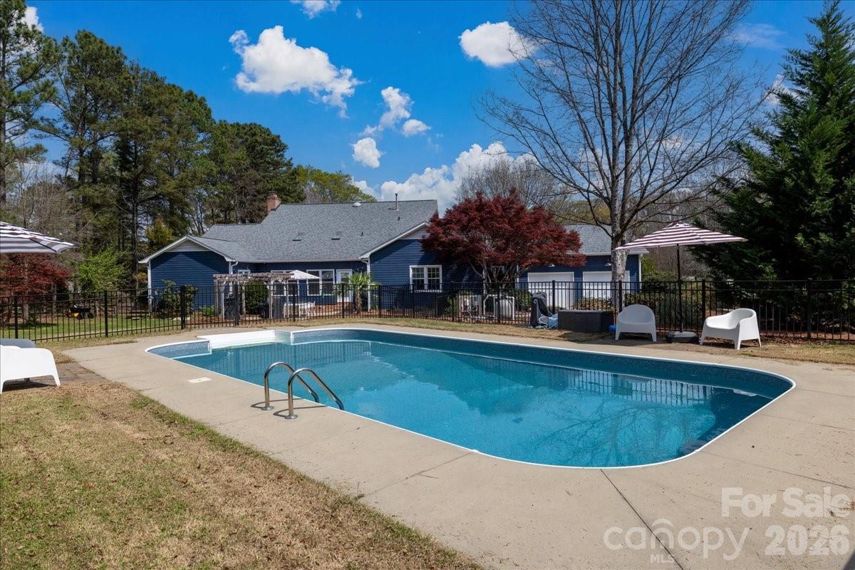 This Southern charmer sits on nearly an acre in the desirable Fairlawn subdivision and offers a private outdoor
oasis, complete with a saltwater in-ground pool. This home is ready to make your own with so many upgrades, including a fully renovated master bathroom with a large shower, white oak vanity, two master closets, and an Ikea Pax system. Saltwater pool is ready for your enjoyment with a new pool liner and generator. Crawl space has been encapsulated with a humidifier, tankless water heater, water softener, and filter, to name just a few additions to this lovely home.
The updated kitchen is a chef’s dream, featuring a large island, quartz countertops, and a premium KitchenAid 48-inch six-burner gas range. In the family room, custom-built-ins frame a beautiful dual-gas-log fireplace shared with the adjoining home office, creating a warm, inviting space for both relaxing and working from home.
The spacious primary suite and bathroom are designed for comfort and luxury. A bright sunroom with custom South Carolina molding opens to the back patio, where you can enjoy peaceful views of the in-ground saltwater pool and large, fully fenced backyard, perfect for entertaining or unwinding in your own backyard retreat. Additional features include abundant storage throughout the home, including a temperature-controlled storage room
upstairs. 
With too many upgrades to list, please see the attached feature sheet for the full list of improvements.
Come experience this beautiful retreat and make it your next home!