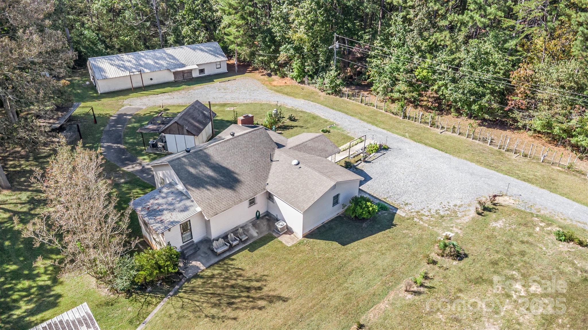 Sprawling over 4+ fully fenced acres, this one-of-a-kind property offers space, versatility, and endless possibilities. The custom-built, one-owner ranch home sits perfectly on the land and was previously home to horses, making it ideal for anyone seeking a hobby farm or room to spread out. A large barn on the property includes office space inside and is already plumbed for water—perfect for work, storage, or future conversion. Additional structures include tractor storage, 1 car detached garage and lower level carport. The home itself features single-level living with a spacious walk-in crawl space. With no HOA, you’ll have the freedom to make this property your own. Bring your animals, business ideas, or outdoor dreams—there’s room for it all here! Being sold as-is.