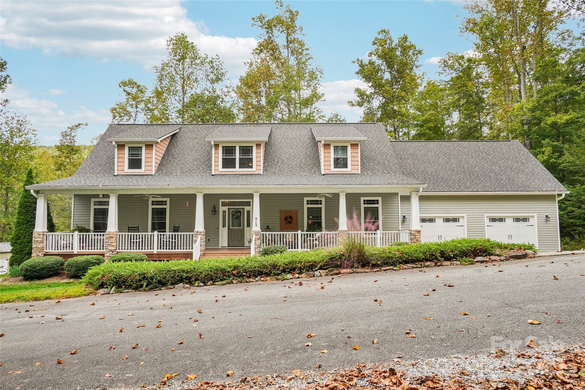 Expect to be impressed the minute you arrive! This meticulously maintained 3BR / 3.5BA home is everything you have been looking for.  Ideally located minutes to town but with all the privacy and security of a gated community with only four homes.  Relax on the rocking chair front porch and enjoy the year-round long range mountain views! This home has been updated with all the modern conveniences every homeowner is seeking. The spacious chefs kitchen offers stainless appliances, gas range, granite countertops, breakfast bar with abundance of cabinetry.   Light and bright living room and separate dining room are ideal for entertaining. Spacious bedrooms offer oversized walk-in closets with built-ins and en-suite bathrooms with stunning granite/tile and high end fixtures. This well appointed floor plan is perfect for extended family and guests! Many recent updates include: whole house Kohler generator, upstairs HVAC and roof. 2 Car garage with abundance of storage space. Relax on the large back deck and enjoy the spacious fenced back yard perfect for gardening and pets!  This spacious 1.91 acre lot offers the comfort and serenity of mountain living in a peaceful private setting.  Nestled between Hendersonville and Lake Lure.  A  MUST SEE!  MOTIVATED SELLERS - PRICED BELOW RECENT APPRAISAL!!
