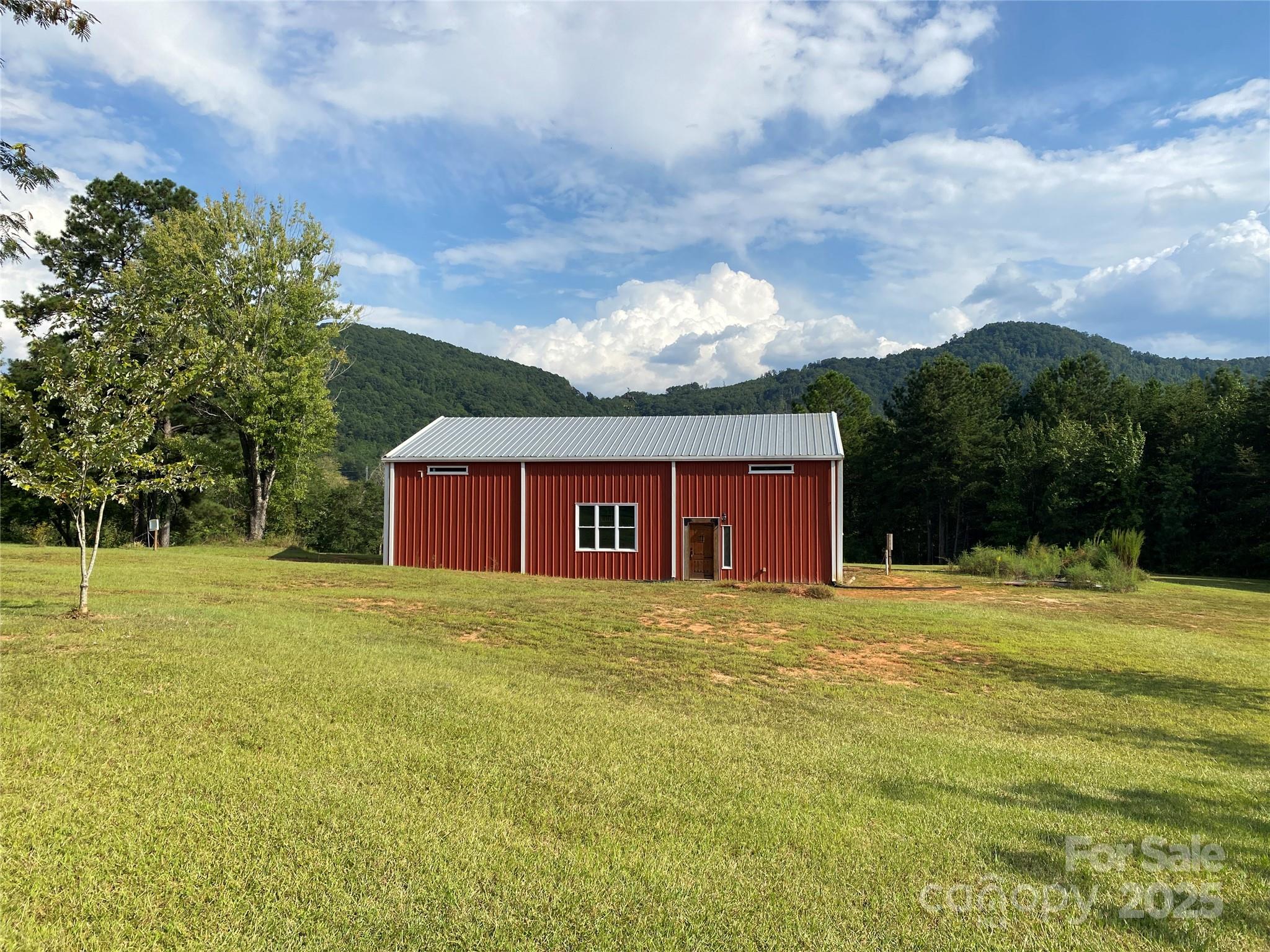 Escape to your own slice of paradise with this breathtaking 8-acre property, offering serene mountain views and a private, fully stocked pond. This rare gem combines natural beauty with ultimate privacy, making it the perfect retreat or forever home.Expansive 8 Acres: Plenty of space for recreation, gardening, or enjoying the peace and quiet. Stunning Mountain Views: Wake up to breathtaking vistas and relax with stunning sunsets.  Private Stocked Pond: Ideal for fishing or simply unwinding by the water’s edge.Potential for a Dream Home: Complete the interior of the partially finished Barndominium to your liking for the perfect home/lodge. 16' Eave Height, open floor plan currently configured as a 1 bedroom but has a 3 bedroom septic system installed so a second floor can be easily added to this floor plan.  Suitable for outdoor enthusiasts, hobby farms, create a secluded getaway or amazing venue.

Barndo does not have CO yet see comments.