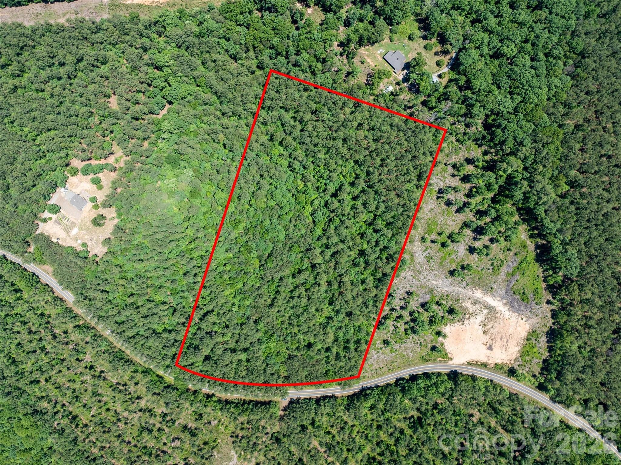 Conveniently located between Lake Lure, Rutherfordton, and Tryon International Equestrian Center, this gently sloped lot offers an excellent oppportunity in Rutherford County. This choice property has frontage on state maintained & paved Clark Rd, and the usable topography allows for plenty of room to create  your homestead(s) while ensuring privacy and seclusion. Minimal deed restrictions assure continuity of development, yet importantly still allow for one subdivision of this lot. With the ideal lay of the land, the opportunity exists to open up multiple acres homesite(s), outbuildings, clearings for pastures, and more. All said, this beautiful property represents a great opportunity in the market, offering the buyer flexibility, easy topography for building, and a central location with easy access and paved frontage.