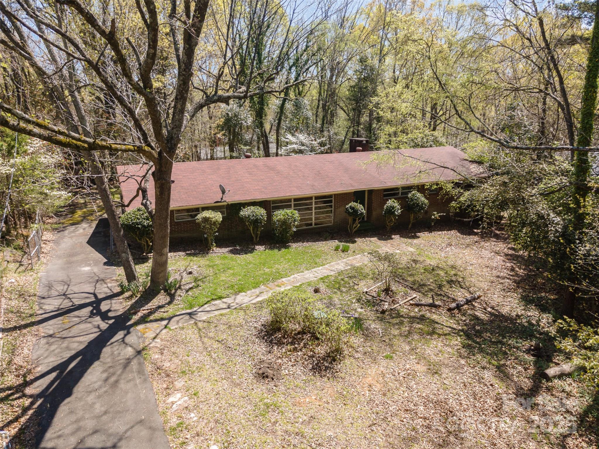 Great location with tons of potential! This well-built, full-brick home sits on a fantastic oversized lot on a quiet road, making it a perfect canvas for its next owner. Whether you're looking to renovate, expand, or enjoy it as is, the solid construction and timeless character provide a great foundation. The large lot offers ample space for outdoor living, gardening, or future additions. Located in a highly desirable area, you'll enjoy easy access to top-rated schools, shopping, dining, and major highways—all while tucked away in a peaceful setting. Don’t miss this rare opportunity to own a home with incredible potential in a sought-after Charlotte location!