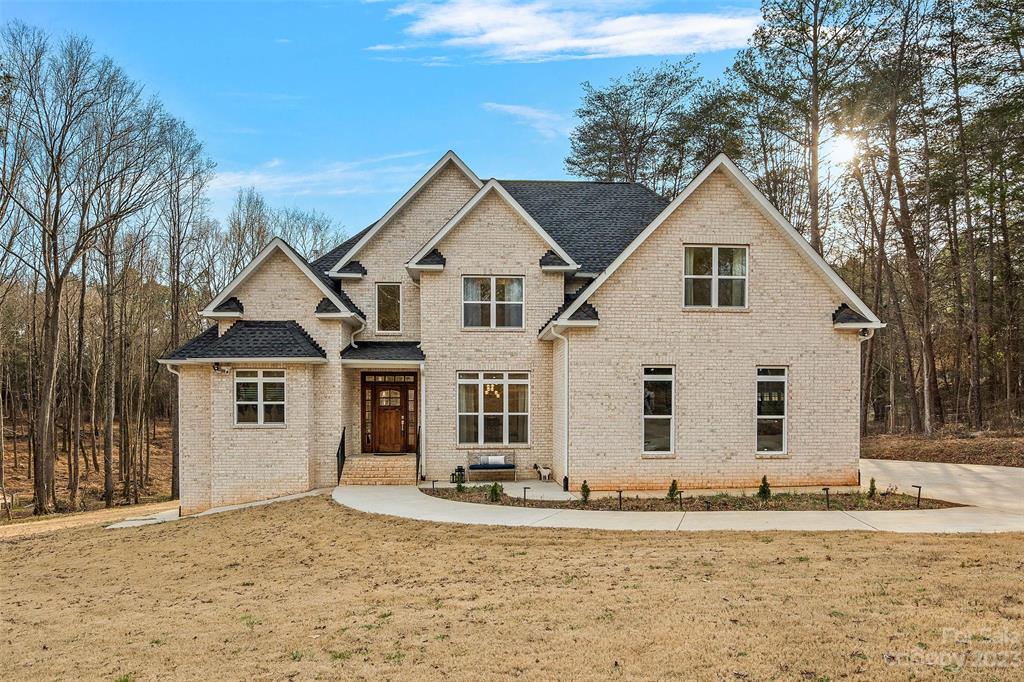 Newer (Barely lived in) FULL Brick 4-Bedroom Custom Home on 3-Acres-FENCED-NO HOA! Desirable location of Indian Land, SC. High-end finishes & Custom Light fixtures! GORGEOUS 4" White oak floors, White Cabinets w/soft close Drawers. Quartz countertops w/Large Kitchen Island & Breakfast Bar. SS Appliances & Range hood. Large open Gathering Rm adjoins Kit & Keeping room. Private Primary Bedroom ensuite w/ Delux bath boasts Quartz Vanities, Tiled floor & Dble person Jacuzzi. Second Level w/White oak flooring thru out. Large secondary Bedrooms have "Jack & Jill" Full Bath. HUGE Bonus/Media Room! Impressive, Fully Finished Basement. Living Rm-Rec Rm-Bed/Bonus-Office & Saferoom/Canning room. Great 4 Entertaining w/Walk out Patio! Designated fenced garden area, fruit trees-sheds-chicken coops ready for your mini-farm. RINNAI tankless heater. Wired for back-up generator. If sold w/adjoining lot, total of 5.317 ac is fenced. ****NOTE: SALE INCLUDED BOTH PARCELS (MLS 3940811 AND MLS 3940814)