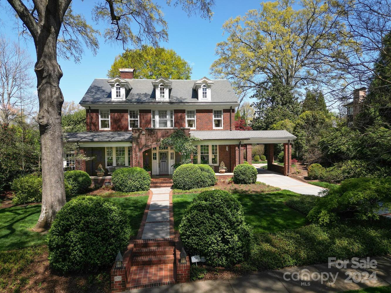 Simply grand. This circa 1925 elegant home is located just around the corner from the Duke Mansion in a very sought-after pocket of Myers Park. High ceilings, large rooms w/classic details such as pocket doors & original glass windows, built in cabinetry. The timeless updates are current yet work so well w/the original architecture. Main level offers formal living & dining rooms. Additionally, there is a library/card room, sunroom & expansive kitchen/family room that is the width of the home. French doors along the back of the home offer a wonderful view to the lush & private back yard or screened porch. Upstairs you will find 5 bedrooms each w/high ceilings & large windows. The 3rd floor has a large rec room that can be used for exercise. The basement has a wine room & secondary laundry space. Located on a historic street, the home is close to neighborhood restaurants, coffee shops, the greenway and nearby hospitals.