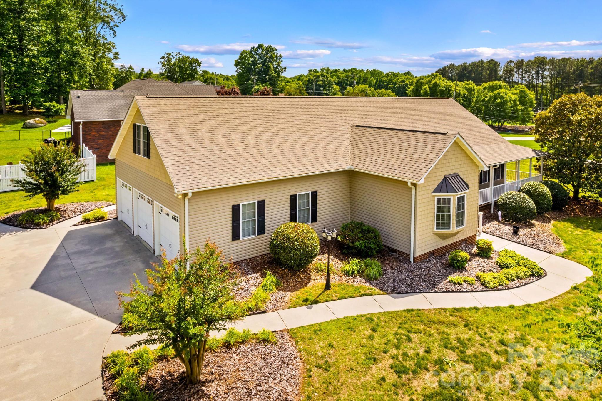 Located on a beautiful corner lot in Greystone Subdivision, this immaculately maintained home offers space, comfort, and convenience just minutes from the heart of Faith, shopping, restaurants, and I-85. Situated on .68 acres, this 4-bedroom, 3.5-bath home features generously sized rooms throughout and an inviting open-concept layout designed for everyday living and entertaining. Plus don't forget the 3 car garage as a bonus! The spacious living area showcases a striking stone-surround fireplace and flows seamlessly into the dining area and expansive kitchen complete with granite countertops, classic maple cabinetry and a charming bay-window breakfast nook. Large windows throughout fill the home with natural light. The main-level primary suite offers a large walk-in closet and private bath with jetted tub, separate shower, and double vanity with granite counters. Secondary bedrooms feature ample closet space and easy access to an oversized hall bath. Upstairs, you'll find an additional bedroom, full bath, and a versatile bonus room ideal for a media room, playroom, hobby space, or home office. Beautiful landscaping, a dedicated laundry room, and a roof replaced in 2023 complete this exceptional property.