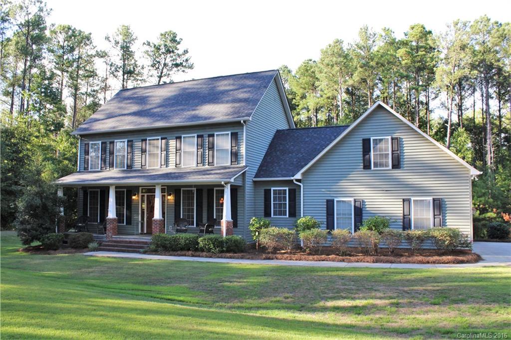 Beautiful 4 bedroom, 3 bathroom, home nestled on 5 acres. Featuring 2 car attached garage, bonus room, many built ins, custom cabinets, custom two-drawer dish washer, gas fireplace, full chimney for wood burning option, laundry chute, concrete driveway and irrigation system. This home has been very well taken care of.  Come out so you can experience the beautiful hardwoods, lovely custom kitchen, comforting screened in back porch with its own TV. This one won't last long. Horse Allowed !!!!