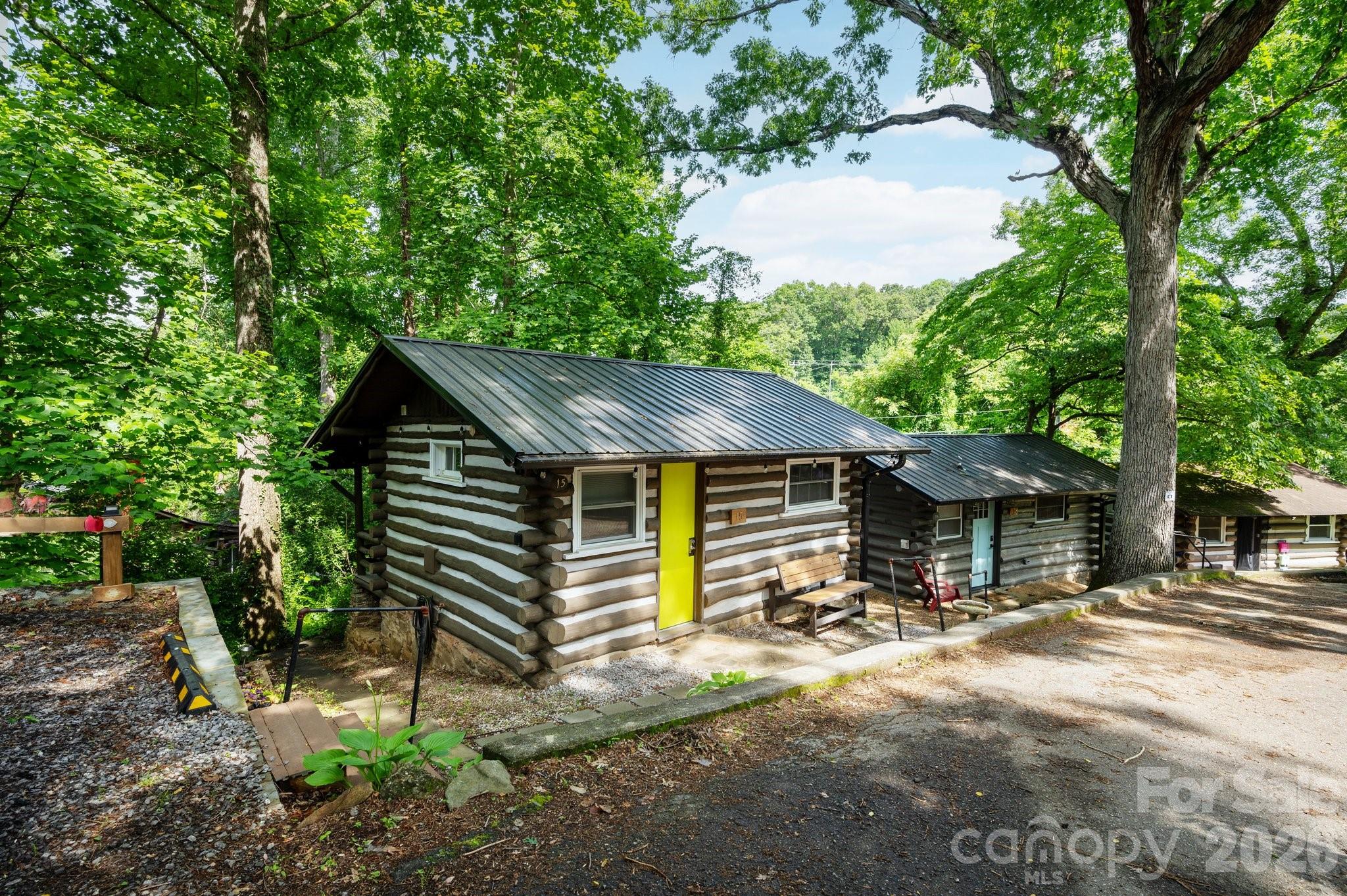 Unique opportunity to own two renovated cottages in historic Homeland Park, Asheville’s original tiny home community. Located minutes from the Blue Ridge Parkway, VA Hospital, Downtown Asheville and Black Mountain. Offered as turn-key 30-day rentals, these two studio/cottages are being sold with most of the furnishings and equipment included. Solid rental income history available. These adorable cabins offer open and efficient living space with vinyl plank flooring, min-splits for heating and cooling, washer/dryers and wonderful back decks surrounded by greenery. 15 Cottage includes off-street parking and a storage shed. Historic Homeland Park Resort was developed in the 1930s and included 65 cabins and cottages where vacationers enjoyed our beautiful mountain setting. 16 Cottage Drive is available for separate purchase (see MLS# 4280433) but 15 Cottage Dr. is only available as a package with 16 Cottage Dr.