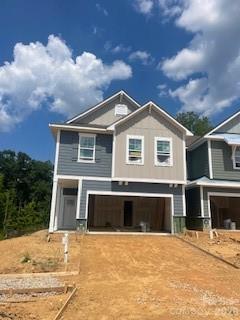 END Townhome-Discover the ease of luxury low-maintenance living in this brand-new Bushwick IV townhome, conveniently located just minutes from Ballantyne, Waverly, and the charming shops and restaurants of historic downtown Waxhaw. Filled with natural light, the open-concept living area is highlighted by three large picture windows overlooking a private wooded backyard. The designer kitchen features 42” Frost colored soft-close cabinetry, sleek quartz countertops, a spacious wrapped island open to the family room, Frigidaire stainless steel appliances, an exterior-vented range hood, and a pantry with solid shelving. The main level showcases durable LVP flooring throughout, along with composite stair treads leading to the second floor. Upstairs there is a loft area with LVP flooring, unwind in the luxurious Owner’s Retreat featuring a tray ceiling, oversized walk-in closet, and three large windows that create a bright, airy feel. The spa-inspired primary bath offers tiled flooring, a large tiled walk-in shower with bench seating, oversized dual vanity with quartz countertops and soft-close cabinetry, a linen closet, and a private water closet. The second floor also includes two spacious secondary bedrooms, a full hall bath, and a thoughtfully designed laundry room with tiled flooring and a convenient folding table. Enjoy peaceful mornings or relaxing evenings on the covered porch overlooking the wooded nature preserve. A side-by-side two-car garage and full driveway provide ample parking for both homeowners and guests. With low taxes, low-maintenance living, and the feel of a single-family home, this townhome offers the perfect blend of comfort, convenience, and style. This home is located on one of our best home sites at the end of the street next to the nature preserve surrounding by trees! Ask about special low-interest rate opportunities