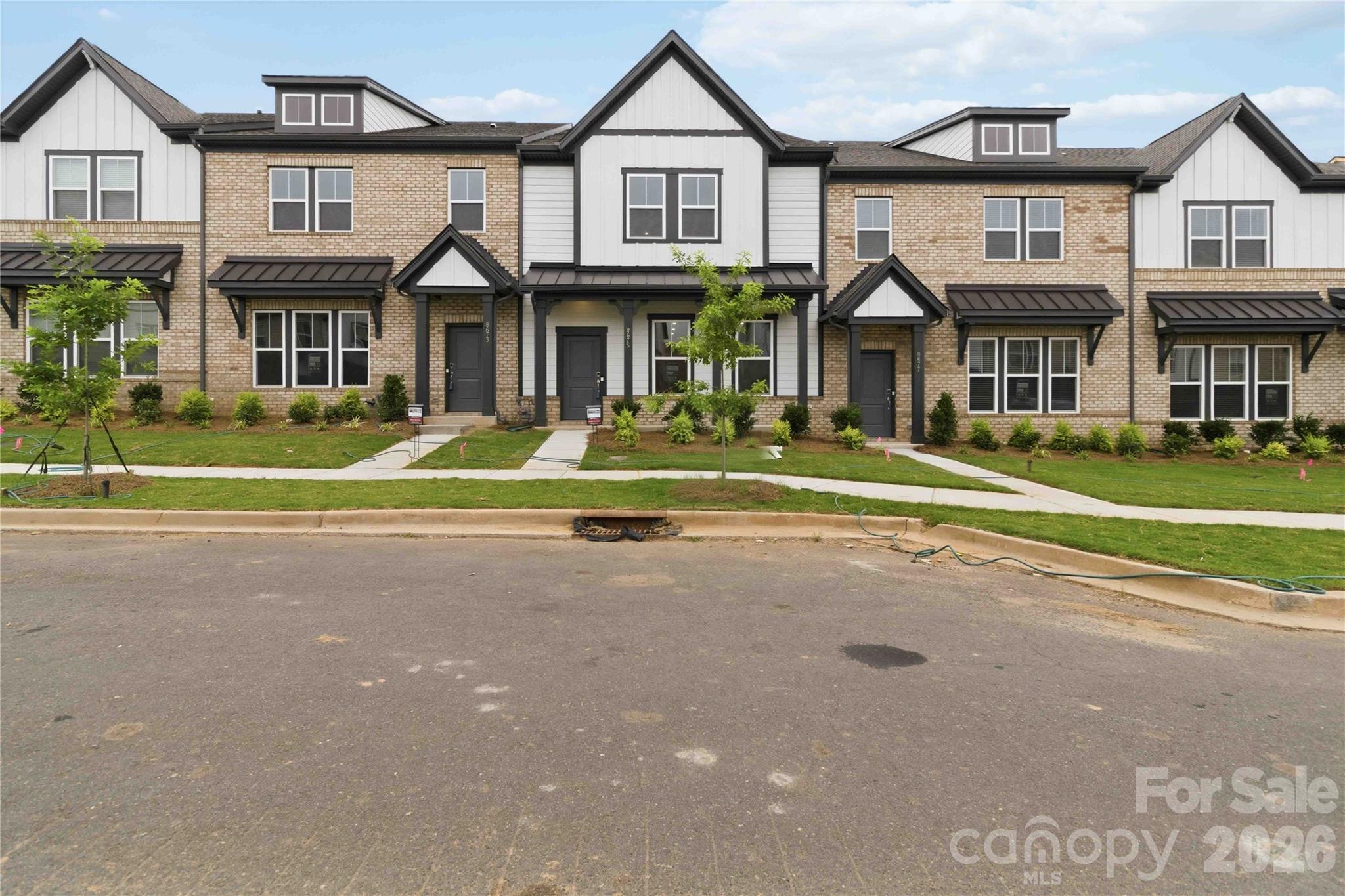 New Construction with May Completion! Built by Taylor Morrison, welcome to the Aspen floor plan at 8673 Miles Gap Road in the Ridge at Sugar Creek. Enter from the rear two-car garage into a thoughtfully designed main level featuring an open kitchen with a walk-in pantry, casual dining area, and a spacious gathering room positioned at the front of the home. A convenient half bath adds everyday functionality. Upstairs, a cozy loft provides the perfect space for relaxing or game nights, along with three bedrooms, a full bath, and a centrally located laundry room. The deluxe primary suite offers a private retreat with two walk-in closets, dual-sink vanity, and a beautifully designed shower. Photos are for representative purposes only. MLS #4322200
