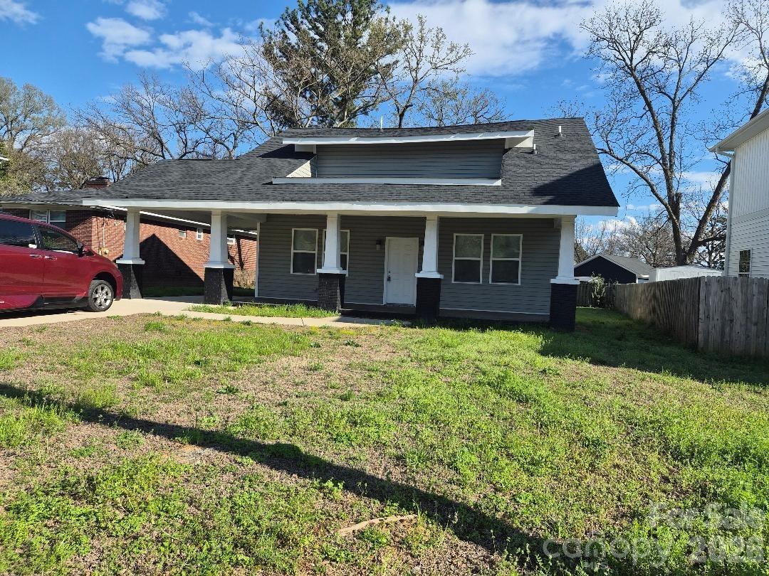 Beautiful History House in downtown Rock Hill. Huge rocking chair front porch covered with easy access from the attached carport and front. Open plan with kitchen, dining room and den all open.  Owner's bedroom on first level with ensuite main bath and two closets.  The front room has a closet so it could be used as a bedroom, living room or study.  All the other bedrooms and baths are on the upper level.  Waiting for you so schedule your visit today!