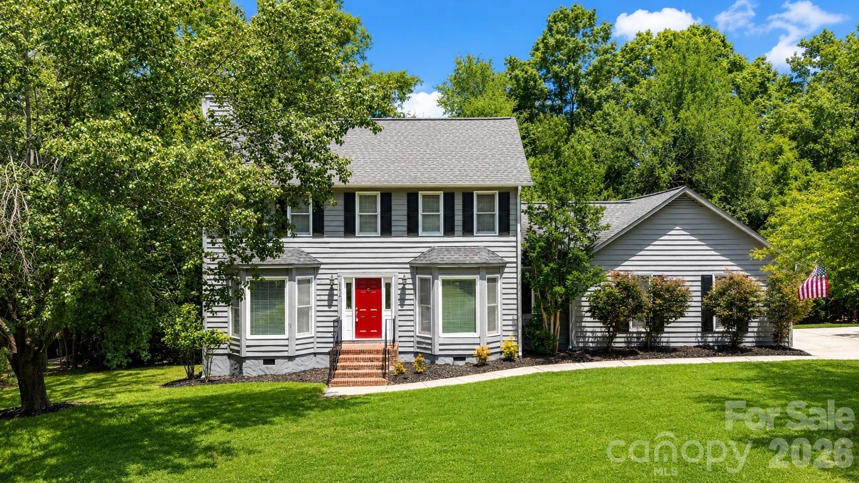 Absolutely gorgeous home nestled in a quiet cul-de-sac in a highly sought-after location on the Tega Cay Peninsula!

This property features a welcoming entrance that flows into an extra-large great room complete with a cozy fireplace. The versatile floor plan offers ample space for a dining table in the living area, allowing you the flexibility to utilize the formal dining room as a separate home office. The kitchen has granite countertops and stainless steel appliances and a wonderful pantry cupboard that you will love!

Step out through the doors into a screened deck that sits high up in the trees—perfect for watching the local birds and deer in your wooded retreat. A spacious open deck area with a gas BBQ hookup rounds out this incredible outdoor entertaining space.

The primary suite serves as a spacious retreat, complemented by generously sized secondary bedrooms, lovely bathrooms. A large laundry room and a two-car garage outfitted with built-in storage cabinets complete this picture perfect home.

Tega Cay offers an unparalleled lifestyle for everyone. Enjoy the golf club’s wonderful facilities, dinner at the restaurant, or a pub lunch on the back deck overlooking the course. Community amenities abound with a clubhouse, gym, swimming pool, beachfront areas, boat launches, walking trails, sports fields, tennis and pickleball courts, and playgrounds—all set within a superb wooded environment.

Tega Cay has a unique vibe you will instantly fall in love with. Don't miss this opportunity to own a spacious home with vacation-style living right on your doorstep. Book your appointment today!