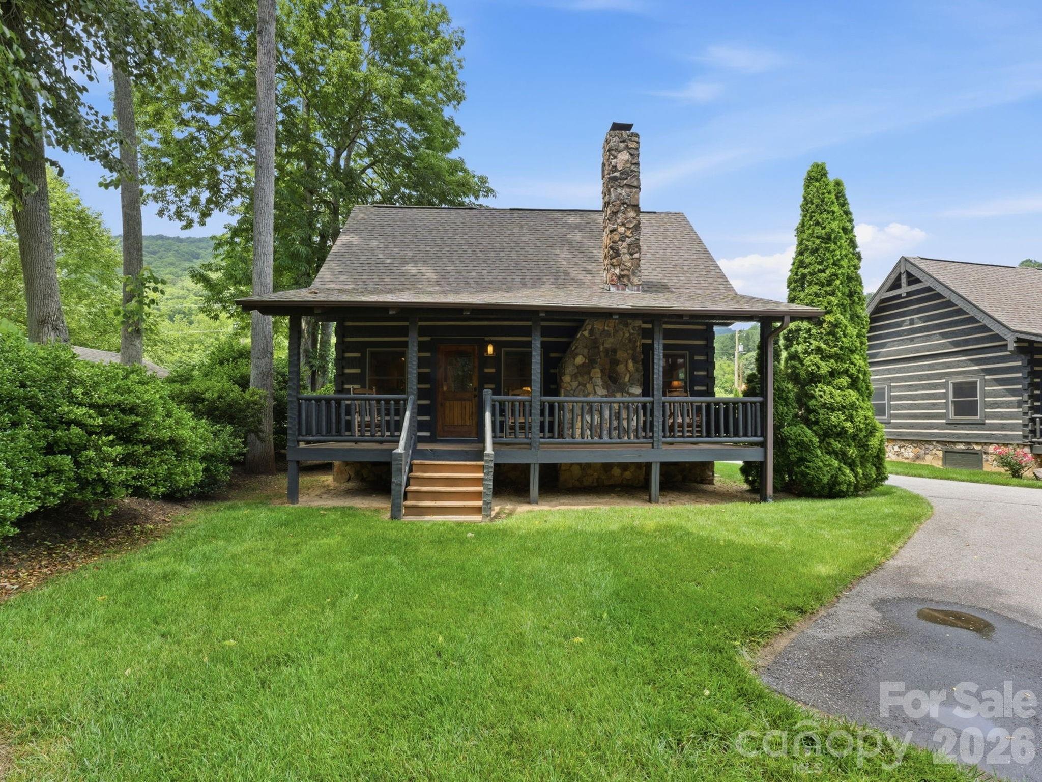 Welcome to Hooked on the Smokies, a charming creek-view log cabin tucked away in the desirable Village at Twin Falls in Maggie Valley, North Carolina. Offering a more private setting than many neighboring cabins, this beautifully maintained mountain retreat sits on a larger yard and enjoys peaceful views of the creek, creating the perfect place to relax and reconnect with nature.
Inside, you’ll find a warm and inviting living space featuring vaulted ceilings, hardwood floors, rustic finishes, and a stunning stone fireplace. The thoughtfully designed floor plan includes 2 bedrooms, 2 full bathrooms, and a spacious loft, providing plenty of room for family and guests. Sold fully furnished and move-in ready, this cabin is ready to be enjoyed from day one.
Spend your mornings sipping coffee on the covered porch while listening to the sounds of the nearby creek, then head out to explore everything Maggie Valley has to offer. From trout fishing, tubing, hiking, and golfing to skiing at Cataloochee and scenic drives along the Blue Ridge Parkway, adventure is always close by.
Located just minutes from downtown Maggie Valley and Waynesville, Hooked on the Smokies offers the perfect balance of privacy, convenience, and mountain charm. Whether you’re searching for a personal getaway, second home, or income-producing vacation rental, this creek-view cabin delivers an exceptional Smoky Mountain experience.
Short-term rentals are permitted, making this a fantastic opportunity to enjoy the property while generating rental income when you’re away.
