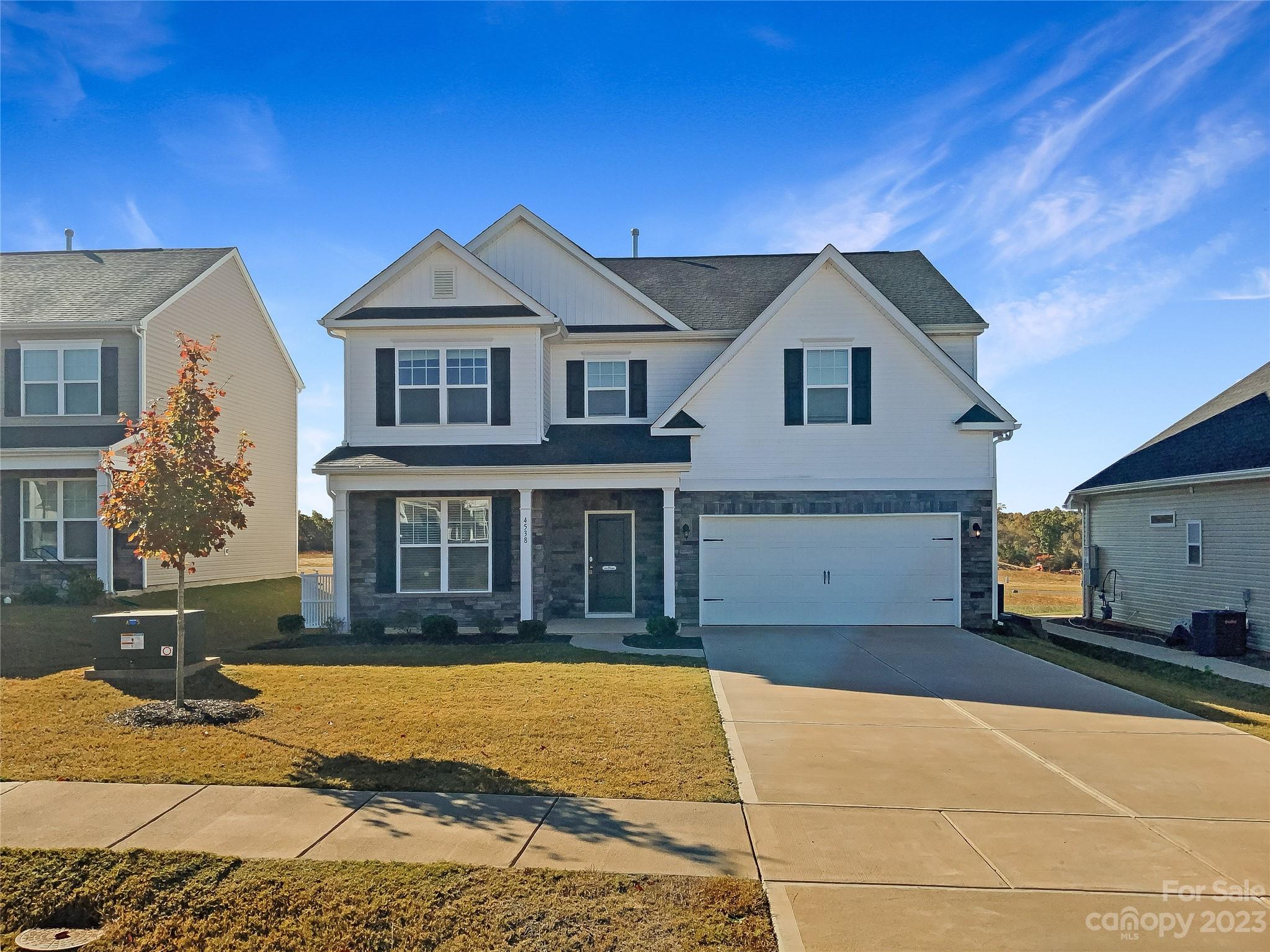 This home is perfect for anyone looking to move right in! With a natural color palette and a cozy fireplace, you'll feel right at home. The kitchen is equipped with a center island and a nice backsplash, perfect for entertaining. The master bedroom has a walk in closet and the other rooms provide flexible living space. The primary bathroom has a separate tub and shower, double sinks, and good under sink storage. Outside, you'll find a fenced in backyard with a sitting area.  This home has all the features you're looking for and more - don't miss out on this great opportunity!
