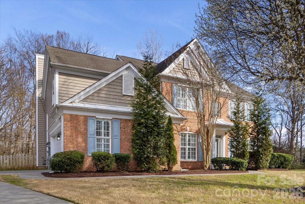 Welcome to this beautifully maintained home nestled in a vibrant community featuring a pool, tennis courts, pickleball, playground, scenic lake, and walking trails.

Inside, you’ll find an inviting open floor plan perfect for everyday living and entertaining. The home features a tiled foyer, hallway, and half bath, along with plantation shutters in select areas. The vaulted great room is a true centerpiece with a cozy gas log fireplace.

The spacious kitchen offers granite countertops, an abundance of cabinetry, and ample storage—ideal for any home chef. A dedicated office or den on the main floor provides flexibility for work or relaxation. The dining room and primary bedroom both showcase tray ceilings, adding architectural charm.

The expansive primary suite includes a bath with separate shower and garden tub, dual sink vanity, and a large walk-in closet.

Enjoy peaceful outdoor living on the rear deck overlooking wooded privacy with serene Flat Branch Creek views, plus a fully fenced backyard—perfect for pets, play, or relaxing outdoors.

This home combines comfort, style, and a fantastic community setting—don’t miss your opportunity to make it yours!