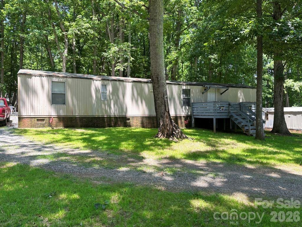 This recently updated 2-bedroom, 1-bath singlewide offers comfortable living on a generous .39-acre lot with a level lawn ideal for everyday enjoyment. A gravel driveway provides easy access, and the large front deck creates a welcoming outdoor space for relaxing or entertaining. The property also features a dedicated firepit area, perfect for gathering outdoors.

Inside, the home includes thoughtful updates that enhance both style and functionality. With its open outdoor space and practical layout, this property offers a versatile setting ready to suit a variety of needs.

Within 5 miles of Piedmont Lithium, buyer and buyer's agent should verify what is important to the buyer.