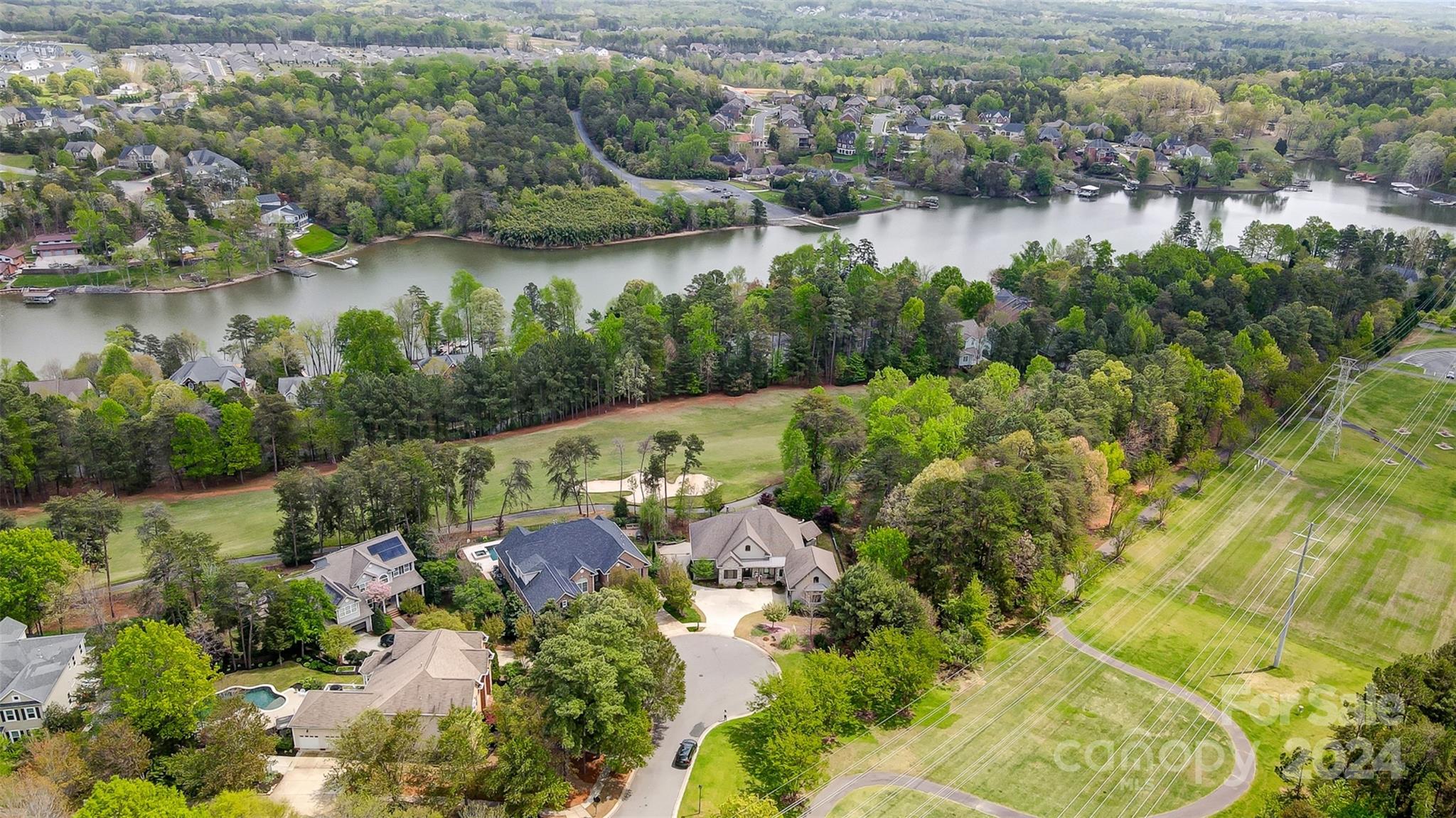What a wonderful setting and opportunity: cul-de-sac, golf course,  a heated, saltwater 2023 inground pool with a whirlpool/waterfall and a sun shelf with 2 Umbrellas. Sprawling full brick 1 1/2 story with solar panels! Hardwood floors, new carpet in 3 bedrooms. Master suite on main opens to the covered porch, shower, whirlpool, double sinks and custom closet. Kitchen features island with gas cooktop, double ovens, microwave and fridge. Spacious b.fast area overlooks a Rose arbor. The familyroom has a cathedral ceiling. F/P w gas logs, built-ins and bar area. Blinds there are remote controlled. Dining room is large and from the living area you step out to the covered porch. Beautiful view of the pool and the golfcourse and beyond. Lots of plantings to discover and there are also 3 raised garden beds. Upstairs is a large bedroom w. full bath and a bonus room.  Large laundry room with W/D, sink, cabinets and second fridge.
Garage +/_ 24.5x24.5.  Walkin attic has encapsulated insulation.