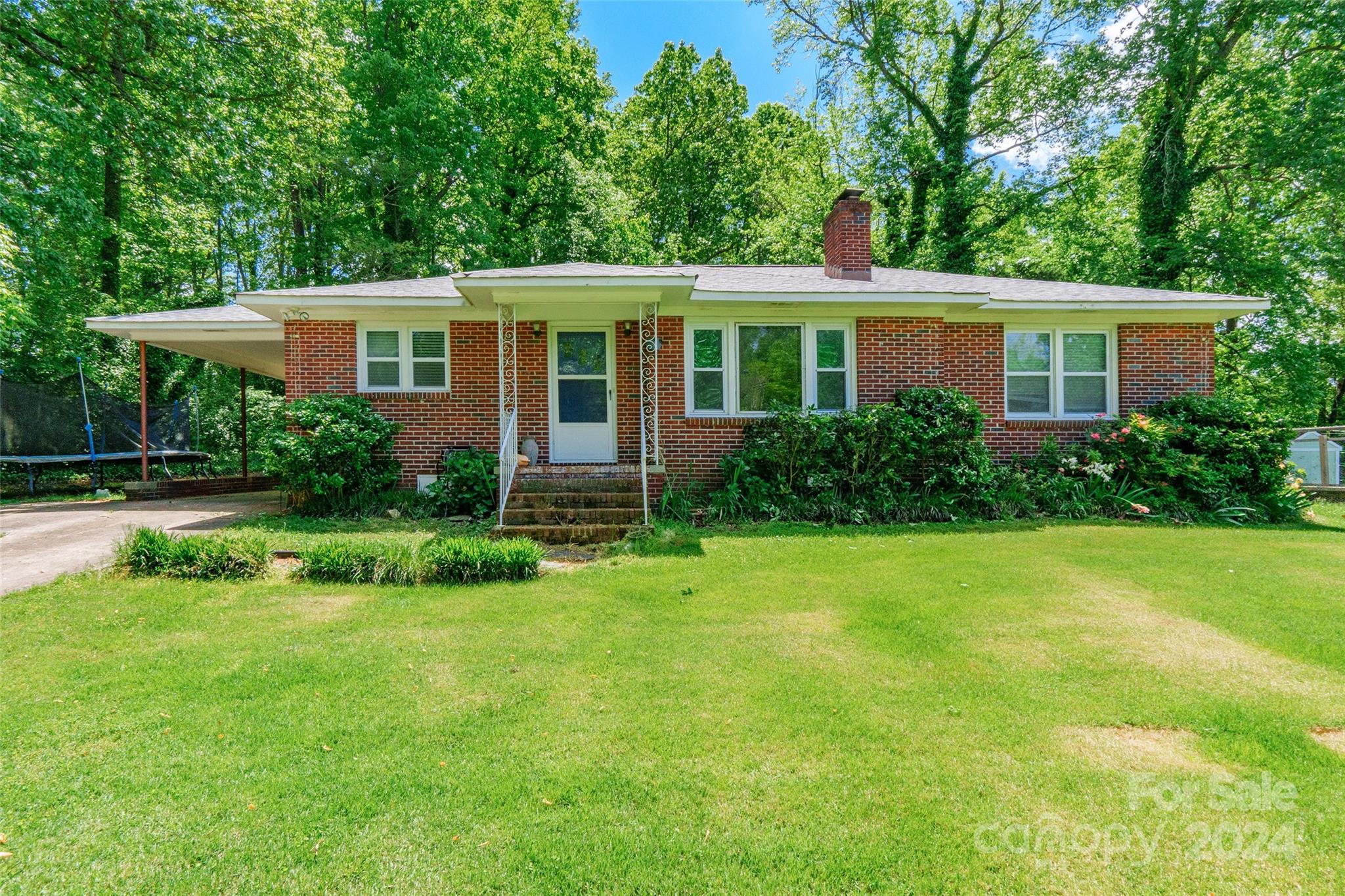 Welcome to this inviting brick ranch home offering 3 bedrooms and 1 bath. As you step inside, you're greeted by a spacious living room, seamlessly connected to an adorable kitchen adorned with tile floors, a charming backsplash, and granite countertops. Bathed in natural light from an over-the-sink window, the kitchen boasts ample cabinet space and an inviting eat-in area. The bathroom features a convenient tub and shower combo, along with dual sinks for added convenience. Refinished hardwood flooring graces some rooms, adding warmth and character to the home. Outside, you'll find a spacious yard with a shed, providing plenty of room for outdoor activities and storage. Additional perks include a new roof and an HVAC unit replaced in 2018. Situated in a fantastic location close to downtown, shopping, dining, and medical parks, this home offers both convenience and comfort.
