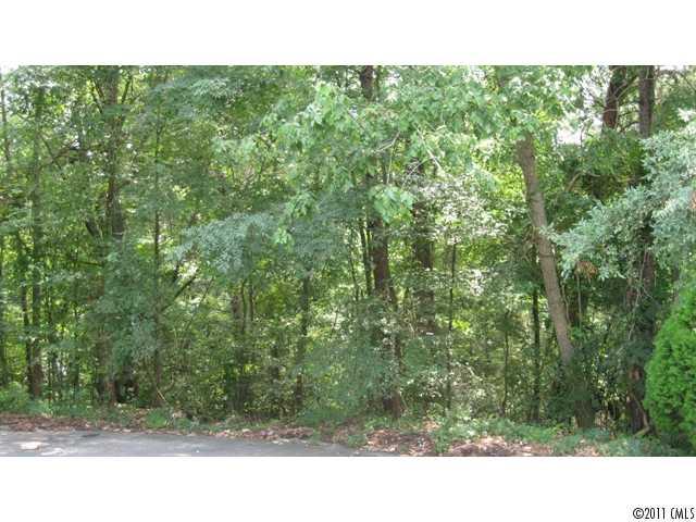Beautiful homesite on cul-de-sac lot with a wide greenbelt view in the back. Come enjoy all of the amenities that Tega Cay has to offer, Golf, swimmming, Lake, Walking Trails. Adjacent lot, 6035 Agate Ct., also for sale. Both lots may be purchased together for $49,900.