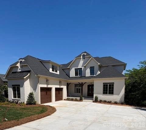 New construction in the prestigious gated Joslin Pointe community on Lake Wylie! This stunning 6-bedroom, 6-bath home offers a spacious open floor plan perfect for entertaining and everyday living. Enjoy lakefront living with your own covered dock and boat lift already in place—just steps from your backyard or enjoy the views from your covered porches. The gourmet kitchen features a large island, premium finishes, and high-end appliances, ideal for hosting and culinary creations. The finished basement offers another living space with  2nd owners suite, family room with wet a bar, island with beverage fridge, icemaker and a versatile space with an optional room ideal for a golf simulator, home theater or workout area. Thoughtfully designed with luxury and comfort in mind, this property provides breathtaking lake views, modern elegance, and private access to one of the area's most sought-after waterfront communities. Live the lake life in style! 
Pictures will be updated after landscaping is completed.
