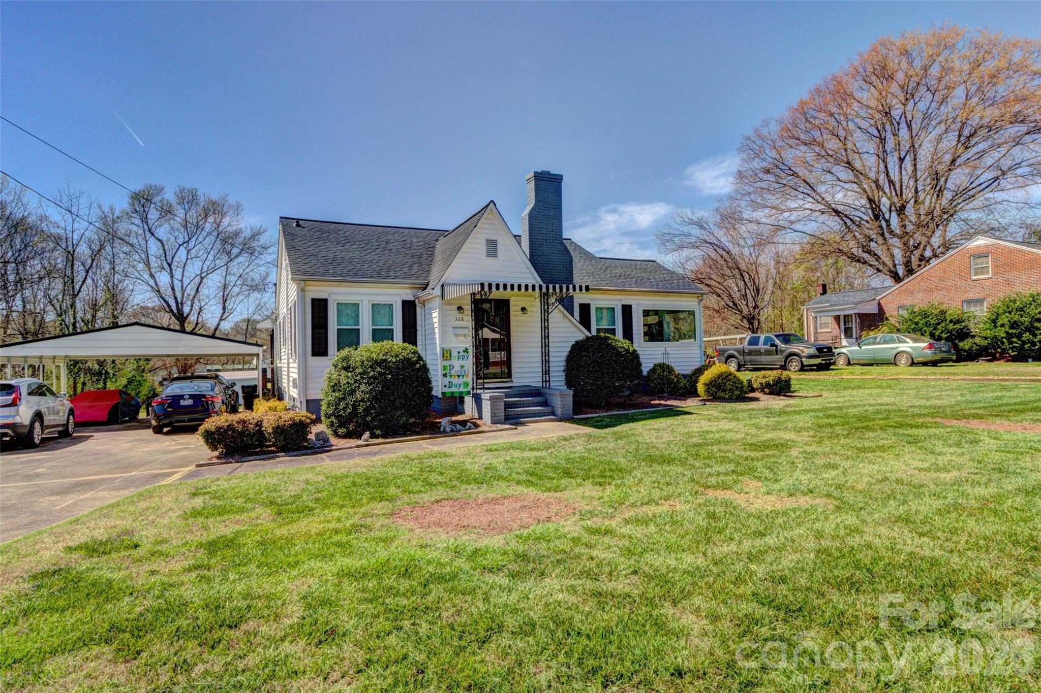 This well-maintained and updated home features two bedrooms, a living room, a den, and a sunroom. The HVAC system is five years old, and the roof was installed in 2025. Some areas of the home still have original hardwood floors.  Recent updates include new windows and a gutter system with a leaf filter.

The outdoor area includes a concrete driveway and a double carport. The covered rear deck comes with a gas grill, which will remain with the property. Additionally, there is a 12 x 20 storage building that is wired for electricity.

The outdoor area includes a concrete driveway and a double carport. The covered rear deck comes with a gas grill that will remain. Additionally, there is a 12 x 20 storage building that is wired.