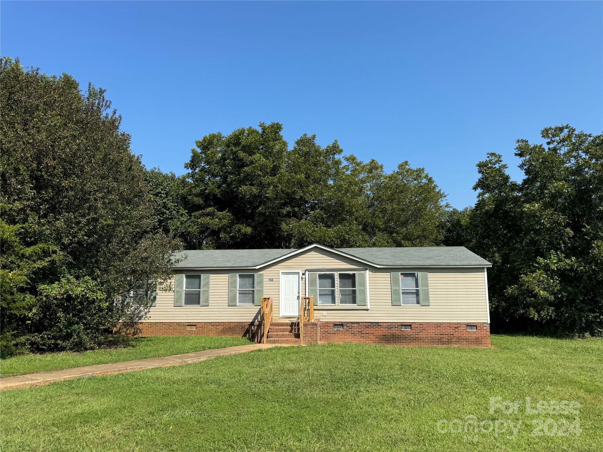 Updated four bedroom, two bathroom double wide trailer in Gaffney. This home offers new flooring throughout. This home offers a large, bright white kitchen, formal dining room and a large living room. The primary suite has a large en suite bathroom, with the additional three bedrooms and second bathroom are on the opposite side of the home. This home offers a large yard and plenty of space. Tenants are responsible for all utilities for the home. This home is pet friendly with pet rent of $30/pet per month.