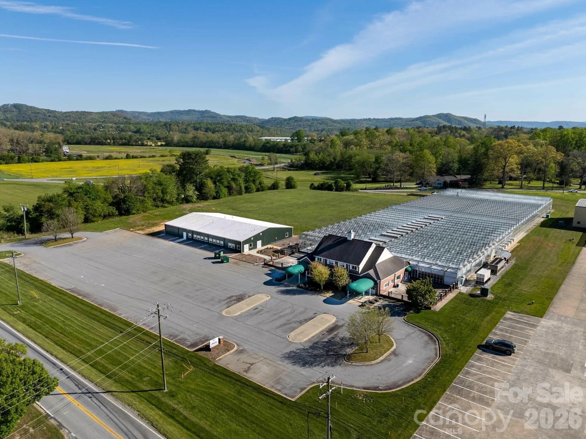 Strategically positioned along a highly traveled corridor, 4076 Haywood Road offers a compelling opportunity to acquire a versatile commercial property in the heart of Mills River—one of Western North Carolina’s fastest-growing business markets. The site provides excellent visibility, easy access to regional transportation routes, and proximity to Asheville Regional Airport, making it ideal for owner-users or investors seeking long-term upside.