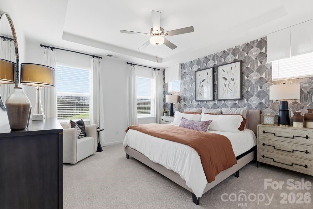 What's Special: Dedicated Study | Covered Patio | End Unit | North Facing Lot. New Construction - Ready Now! Built by America's Most Trusted Home Builder. Welcome to the Avon at 5549 Wolfpack Alley in Terraces at the Exchange. This bright 24-foot-wide two-story townhome in Indian Land offers a welcoming layout that begins with an accommodating primary suite entry off the rear two-car garage, leading into an open-concept kitchen with a walk-in pantry and a casual dining area that flows into the spacious great room at the front of the home, along with a convenient half bathroom. Upstairs, a cheerful study sits at the top of the stairs and creates a perfect spot for work or game nights, while all three bedrooms, including the deluxe primary suite, are located on this level alongside the well-placed laundry room and secondary bathroom. The primary suite features a spacious bathroom with dual sinks, a well-appointed shower enclosure, and two generous walk-in closets. Living here means enjoying walkability to The Exchange, a new retail destination bringing Lowe’s Foods, Costco, Cold Stone Creamery, Club Pilates, Hollywood Feed, Halal Street Food, and more to the area. With easy access to Highway 521, I 485, I 77, and I 85, you will appreciate simple commutes, and nearby favorites like Swig, the new CrossRidge shopping center with Target and the YMCA, and the Promenade at Carolina Reserve with T.J. Maxx, HomeGoods, Starbucks, and Crumbl make every day errands a breeze. Charlotte Douglas International Airport is about 30 miles away when you are ready for a getaway. Additional Highlights Include: tile shower pan, surround, and ledge at primary bath, study in place of loft. Photos are for representative purposes only. MLS#4359811