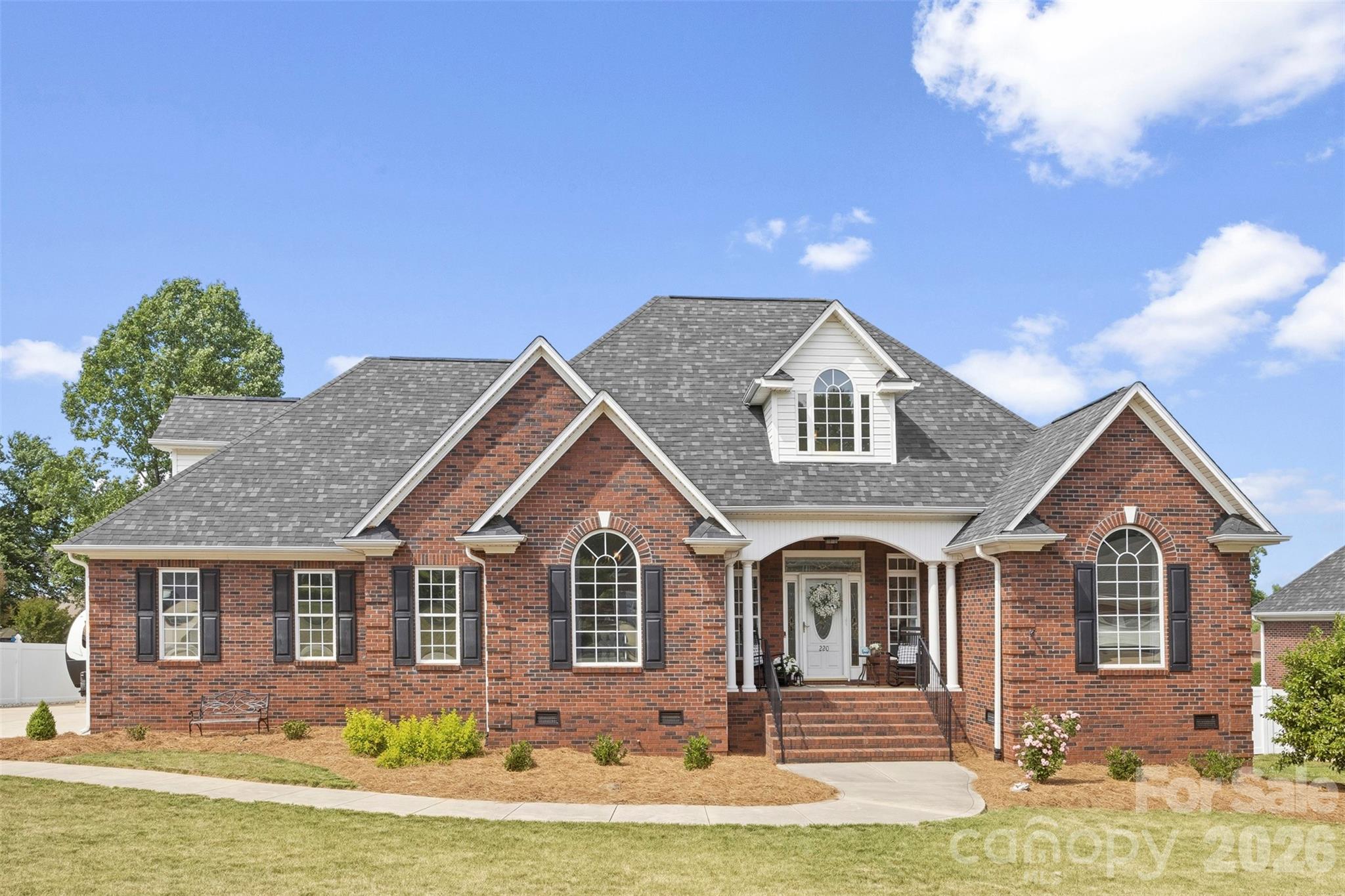 Welcome to 220 Landry Drive in desirable Hall Crossing — a beautifully maintained home offering comfort, space, and convenience. Situated on a spacious lot in an established neighborhood, this property features a functional layout with generous living areas, abundant natural light, and plenty of room to spread out. Hardwood floors flow throughout the living areas and bedrooms, while the spacious great room is ideal for relaxing or entertaining guests. The kitchen features granite countertops, ample cabinet space, and a pantry, and flows into the formal dining room and main living area. The large primary suite offers a huge walk-in closet and a newly renovated bathroom with a new tub, tiled shower, and tile flooring. Two additional bedrooms are located on the main level. Upstairs, you’ll find a versatile bonus room with a half bath, along with a huge of walk-in attic that provides exceptional storage or potentially room to expand. On the back of the home is a nice enclosed porch/sunroom. Walk out back into a large fenced backyard — perfect for gatherings, pets, or play. Additional updates and features include a new roof and water heater in 2025, under-house storage, extended parking with RV hookup, a Christmas light switch, and front yard irrigation. The home is  conveniently located near shopping, dining, schools, and major highways. This a great home - don’t miss out on it!!