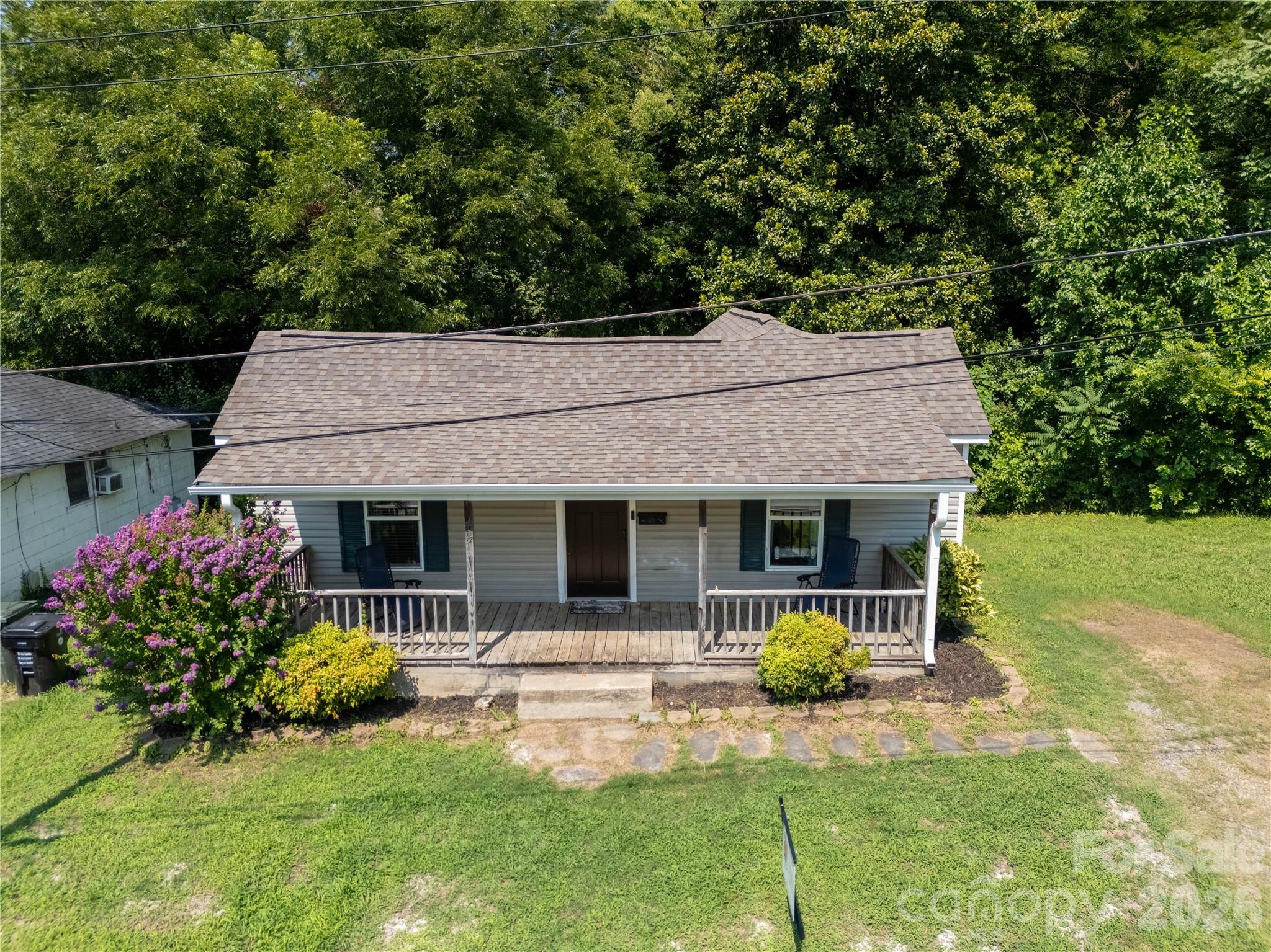 Wonderful first home or investment property.  You aree welcomed by a full covered front porch.  This freshly painted 2 bedroom, 1 bth home offers updated carpet in both bedrooms, new vinyl plank flooring throughout the common areas and the bathroom.  Roof updated 2019, HVAC 2019, new duct work 2025, water heater 2019, hew bathroom vanity.  The tall crawlspace offers plenty of storage opportunity.  The eat-in kitchen features stainless steel appliances including a microwave, new in 2025, smooth top electric range, and dishwasher.  The deck offers a serene spot for morning coffee or an evening relaxing.
