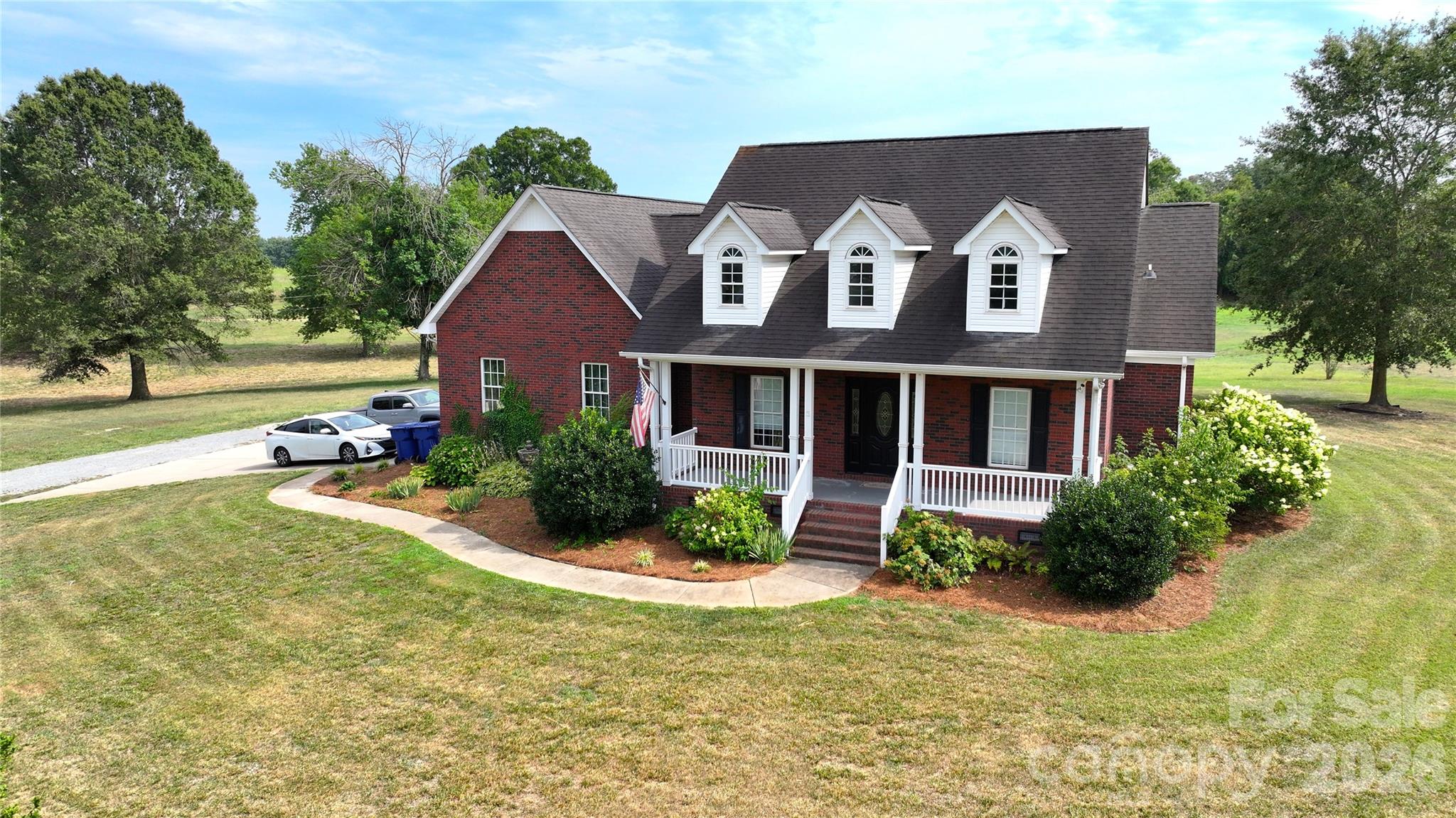 SELLER OFFERING A 1% SELLER CONCESSION TO HELP WITH A RATE BUY DOWN! Welcome to your very own almost 7 acres in Marshville, NC! This peaceful country retreat is the best of rural living without sacrificing convenience. Just 5 minutes to downtown Marshville and under an hour to Uptown Charlotte, the location is as practical as it is picturesque. Featuring a beautiful brick single-family home with 3 bedrooms and 2 bathrooms alongside homesteading infrastructure, fenced land, and a gated driveway. A large barn accommodates up to 8 horse stalls, complemented by a fenced and gated side paddock, an additional 2 stall barn, and a spacious storage shed. The home boasts a large, open concept living area with incredible natural light, alongside a kitchen with tons of cabinets, spacious quartz countertops, and a cozy breakfast nook. Enjoy beautiful pasture views from the large, covered back and front porches, or throw a party on the oversized shaded patio! For over 10 years, the land has been lovingly and naturally maintained with animal impact. No pesticides, herbicides, fertilizers, or row crops here, making this a rare find for buyers seeking acreage ready for organic homesteading. The majority of these acres are green pastures perfect for grazing, with small pockets of wooded areas and large mature trees for shade. The street is quiet, the neighbors are friendly, and the property backs up to the open fields of a quaint tree farm. Opportunities like this do not come along often. Whether you are an equestrian enthusiast, aspiring homesteader, or simply craving space and clear skies at night, this property is ready for you to call it home! SELLER OFFERING A 1% SELLER CONCESSION TO HELP WITH A RATE BUY DOWN!