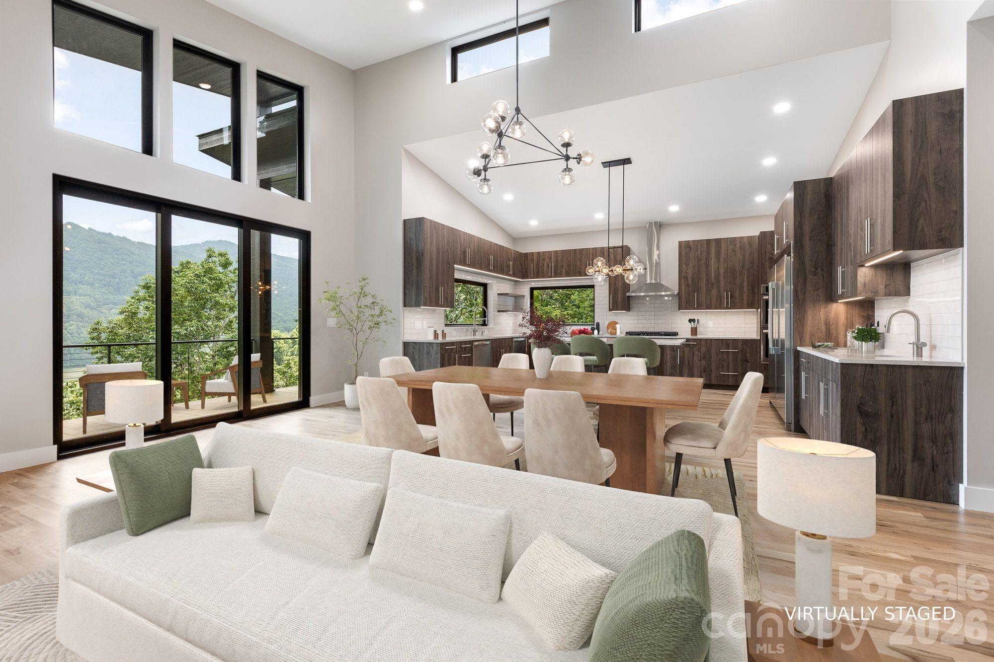 Let’s see how close we got to that list you gave your agent.  A gated community, within easy driving distance to shopping and services, on a minimal traffic road like a cul-de-sac, all you need for everyday living on one level including an office, but space for guests and flex space, a 2-car garage on the main level, year round views from the main level and the lower level, modern construction, not a log cabin, lots of natural light, gas heat and air conditioning, a fireplace, real wood floors, freshly landscaped and move-in ready.  How did we do? 

60 King Horn Ridge is a masterclass in mountain modern living, seamlessly blending mid-century design principles with the comfort and utility required for contemporary life. Spanning 2,762 square feet across two levels on a 1.87-acre lot in the gated Campbell Mountain Estates, the residence provides a rare balance of privacy, scenic views, and accessibility to local shopping and services.

Designed with an emphasis on natural flow and expansive sightlines, the main level offers an ideal layout for one-level living, featuring a convenient entry with only two steps from the two-car garage. Solid white oak flooring on the main level and engineered white oak on the lower level are complemented by porcelain tiles in the laundry and bath areas. Andersen Windows and WinDoor sliders throughout ensure that the home remains filled with light.  

The kitchen features Frigidaire appliances including side-by-side fridge and freezer towers (not a side-by-side but actual full towers), dual dishwashers (yes 2 of them), a 36-inch 5-burner gas cooktop with an induction-ready wiring option, vented range hood, double wall ovens with fan convection, and a Sharp microwave drawer. The cabinetry is frameless European-style with soft-close mechanisms, quartz countertops, a full tile backsplash and solid black walnut floating shelves. A large single-bowl sink is purposefully positioned away from the island to prioritize views from the windows. Under-cabinet lighting, a separate wet bar, and generous pantry allowance will allow a buyer to customize their storage. The great room centers around a gas fireplace clad in real stone with a solid live edge Black Walnut floating mantel.

The primary bedroom is sized to accommodate a king bed and also offers direct access to the rear porch. A generous allowance allows a buyer to custom design the walk-in closet. The ensuite bathroom includes Quartz countertops, large format porcelain tiles, a soaking tub, dual vanities with integrated storage and pre-wired outlets for future lighted mirrors, a separate water closet for added privacy and a frameless shower door.

Unlike typical basement spaces, the lower level of this home has natural light and views, thanks to the three separate 8-foot high sliders. The Flex Space/Family Room serves as an extension of the main living area.  It mirrors the quality and accessibility of the main floor, perfect for relaxation or entertaining. The lower level also has two guest bedrooms, featuring remote-controlled ceiling fans and their own ceiling-mounted mini-split systems for individual climate control. Both offer ensuite access to either a private or shared bathroom and dedicated closet allowances.

The exterior is designed to maximize the potential of the 1.87-acre setting. The front porch provides a shaded, quiet retreat, while the back of the home features multiple outdoor living zones including a covered porch off the primary suite, a second covered rear porch accessible from the common area, ideal for dining and grilling, a main-level open deck for sunbathing or star gazing and a lower-level outdoor living space accessible via three sliders from the guest rooms and family room.

This property offers an exceptional opportunity for buyers seeking a high-quality, move-in-ready home that combines the intimacy of a mountain retreat with the sophisticated finishes of modern luxury design.