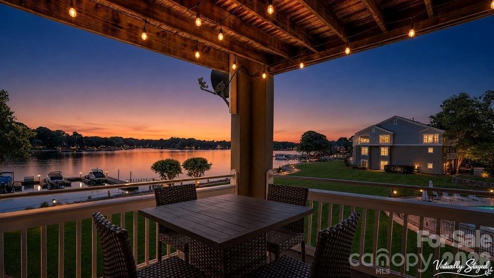 Lakefront living awaits in this nicely updated condo in Davidson Landing’s Emerald Bay. Enjoy long-range, year-round views of Lake Norman from the open-concept living area, anchored by a gas-log fireplace and sliding doors to a covered balcony. This one-level home offers approximately 1,156?sq?ft with two bedrooms and two baths. The refreshed kitchen features nice cabinetry, granite countertops and stainless appliances, while the primary suite includes balcony access and a newly updated en-suite bath. Additional updates include LVP flooring, upgraded bathroom vanities and fixtures, and in-unit laundry. An assigned parking space adds convenience.

Emerald Bay residents enjoy resort-style amenities including a lakeside pool, tennis courts and walking/fitness trails. Monthly HOA dues cover exterior maintenance and common-area upkeep. Davidson Landing also offers boat slips for rent, a dock/pier, playground and lakefront recreation area, making it easy to embrace the waterfront lifestyle. This turnkey condo is minutes from Davidson College, downtown shops and restaurants, and I-77. Whether you’re seeking a primary residence, vacation retreat or investment opportunity, this home combines comfort, modern updates and spectacular Lake Norman views.