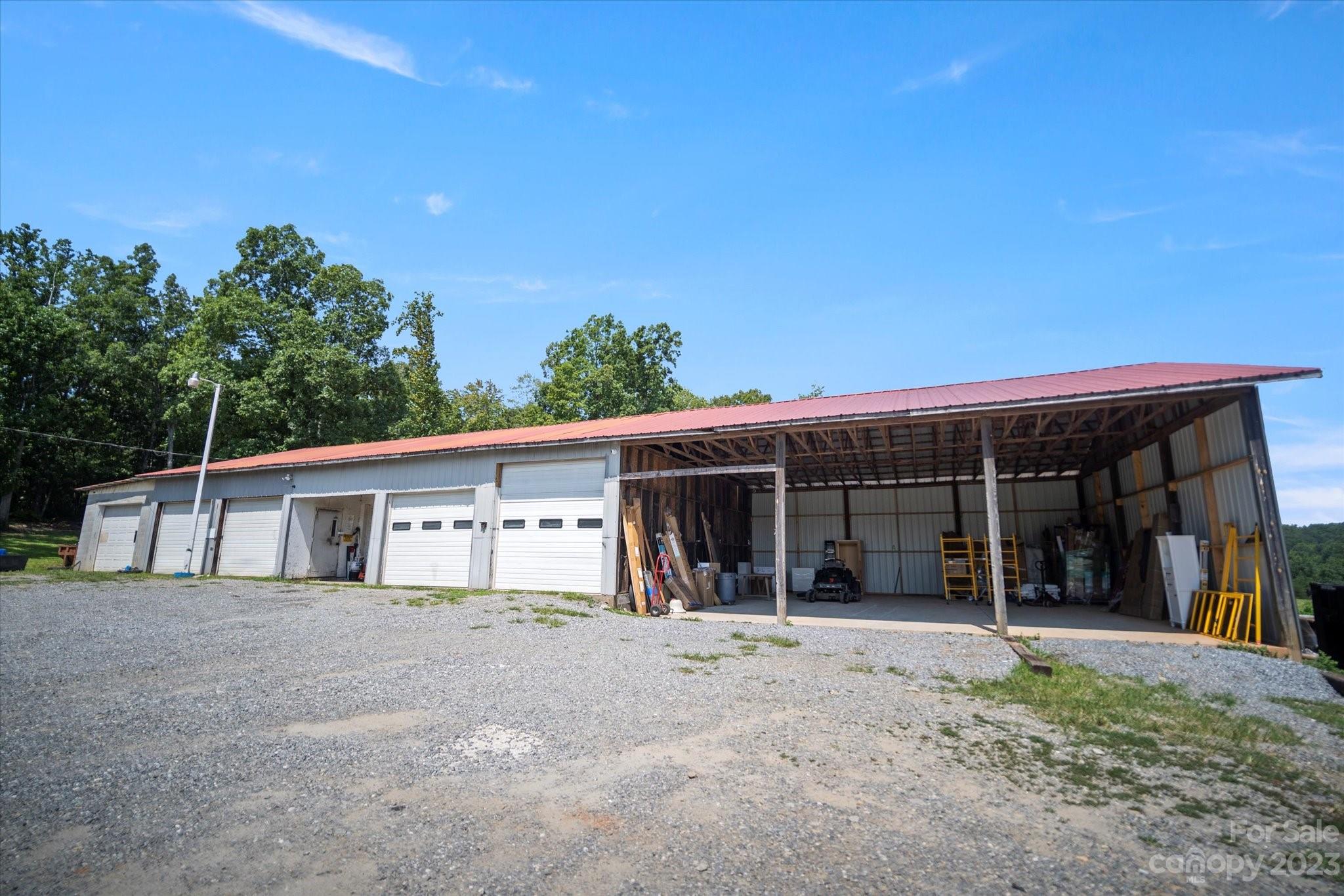 Business opportunity awaits! Expansive closed six bay 80x40 workshop with an attached open 35x35 three bay covered garage with concrete floor. The shop is set up with eight security cameras you can view anywhere from your phone, 80 gallon air compressor, washroom bay with drain, lots of storage. Large parking area on this recently surveyed lot containing 1.88 acres. Bonus features include RV hook-up site at the lower end of the property and plenty of road front footage with easy access from Hwy 226 South. If you need additional garage/business space see MLS#4084490 for more information about the lower Garage building available.