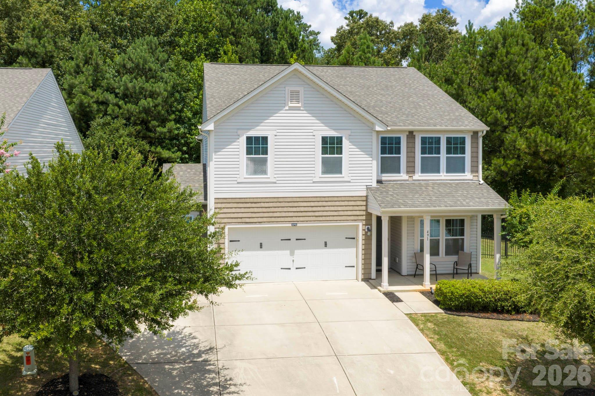 Welcome home to this spectacular 3-bedroom, 2.5-bath property in the sought-after Newport Lakes neighborhood of Rock Hill. Sitting on a rare one-acre lot, this move-in ready home offers a peaceful, tree-lined backyard for ultimate privacy — a true rarity in this highly accessible location, and hard to find at this price point.
The outdoor space is built for entertaining, with a fully fenced yard and an oversized patio perfect for weekend gatherings. Inside, this 2,500+ square foot home features an open-concept main level designed for effortless hosting. The heart of the home is the expansive dine-in kitchen with a central island, walk-in pantry, and a butler's pantry that doubles as the perfect coffee bar — flowing seamlessly into the bright, sunlit family room.
The main floor also includes a private home office, a formal dining room, and a practical drop zone off the garage — ideal for busy families. Upstairs, a spacious primary suite with a private bath anchors the second floor, alongside two oversized secondary bedrooms, a full bath, and a massive bonus room ready for a game room, media room, home gym, playroom, or additional home office.
This rare combination of a large private lot, generous square footage, and an unbeatable Rock Hill location — just one mile from shopping and dining — represents incredible value for the space and price. Schedule your tour of this Newport Lakes gem today, before it's gone!