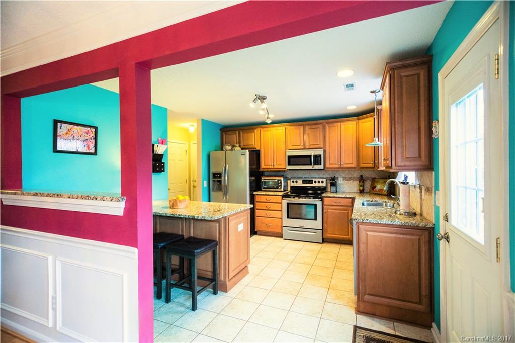 ABSOLUTELY ADORABLE! Beautifully maintained home tucked in a quiet neighborhood in historic downtown Waxhaw. Newly updated gourmet kitchen features granite counters, SS appliances & a large work island. Gas log fireplace in Grt Rm. Picture frame molding in dining area. Spacious master suite w/ tray ceiling, walkin closet, garden tub & separate shower. The inviting rocking chair front porch & private deck in the fenced backyard are perfect for relaxation and entertaining! NO HOA. 1 year WARRANTY!