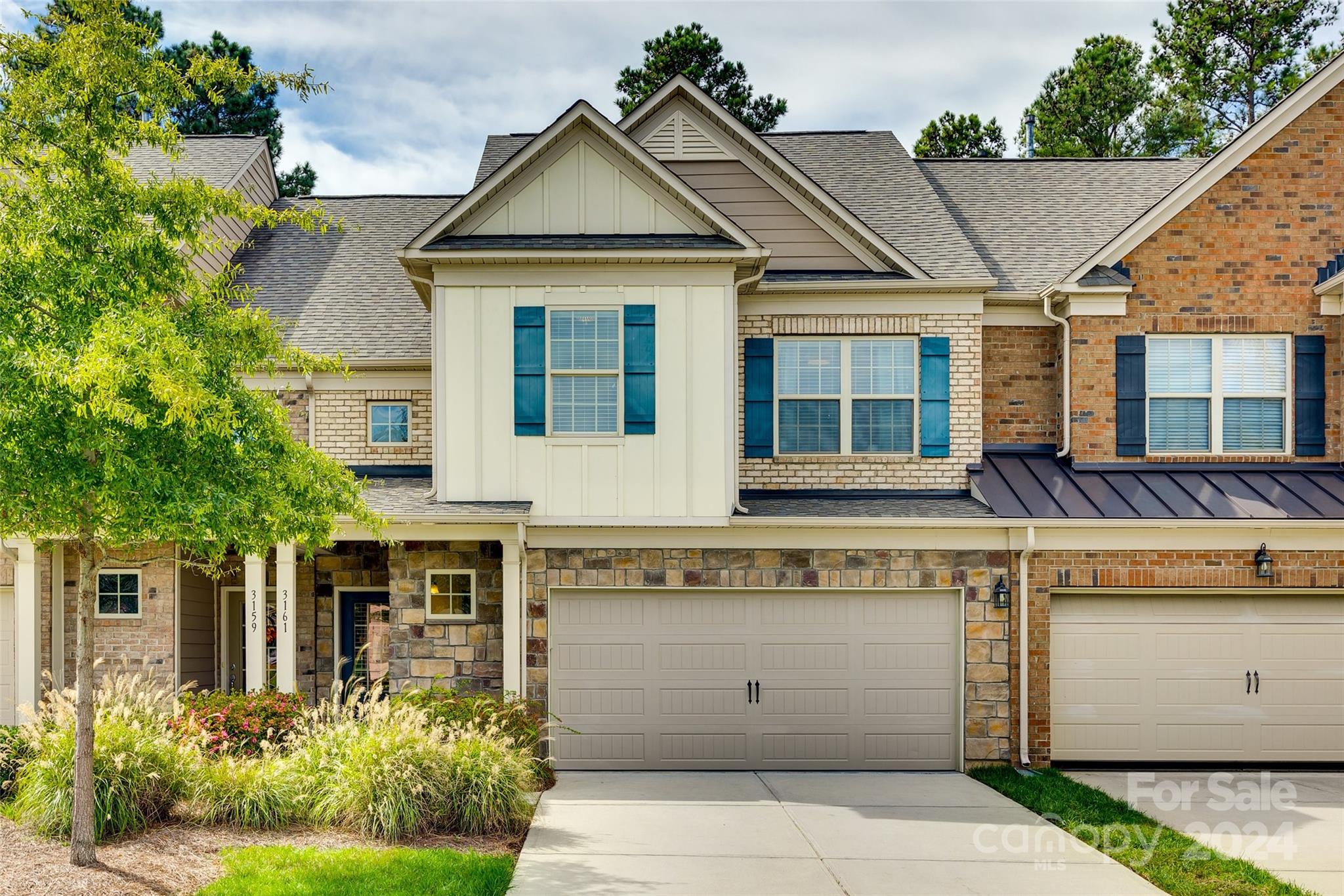 Welcome HOME to this GORGEOUS townhome in sought-after community of Bridgemill! Features brick exterior & 2 car garage! Wide plank flooring throughout 1st floor. Gorgeous upgraded kitchen; quartz counter-tops, stainless steel appliances, walk-in pantry, spacious breakfast bar & upgraded light fixtures offers an ideal blend of comfort, style, & convenience. Charming covered front porch & open floor plan; creating a seamless & modern flow. Cozy stone gas fireplace to enjoy the ambiance. Upstairs you'll find your Owner's Suite w/ spacious walk in Closet, quartz dual vanities & an enlarged walk-in shower. Along w/ 2 additional bedrooms & a loft; ample space for family, guests, or home office! Private back patio; fenced yard backing to a serene wooded border, offering unparalleled privacy! Bridgemill is known for its amenities including 2 pools, tennis courts, club house, fitness center, 3 playgrounds, walking trails, basketball & volleyball courts & lots of neighborhood activities!