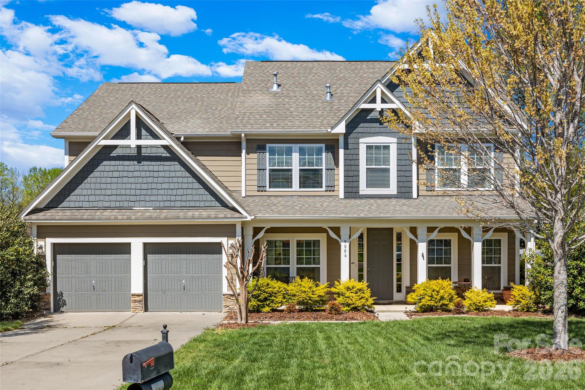 This spacious four-bedroom home offers everything you need, starting with an open floorplan featuring beautiful hardwood flooring on the main level. The chef's kitchen is highlighted by a center island/breakfast bar, granite countertops, a tile backsplash with accent tiles, and Stainless Steel appliances, including a four-burner gas range/oven, wall microwave, and dishwasher, flowing into the great room with a cozy fireplace. The main level also includes a formal dining room perfect for entertaining, showcasing a trey ceiling and decorative wainscoting, a large, dedicated office space, a bright sunroom with three walls of windows, and a convenient drop zone at garage entry. Upstairs, a wide landing leads to the bedrooms and a flexible bonus room with a double-door entry. The luxurious primary suite features a trey ceiling, fan, and an expansive bath with a tile floor, granite counters with double sinks, a large shower with black framing, a garden tub with niche shelving, and a separate water closet. All secondary bedrooms are spacious with walk-in closets and ceiling fans, with Bedroom #2 offering a private ensuite. Exterior features include a beautifully landscaped, fenced rear yard and excellent outdoor entertaining space with both a covered patio and a slate patio adorned with string lights. Come visit this well cared for home.